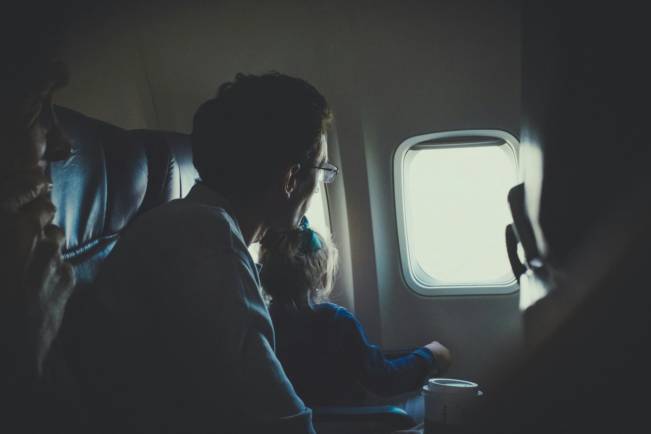 Encouragement for tired parents — family traveling with children at airport learning patience and emotional growth