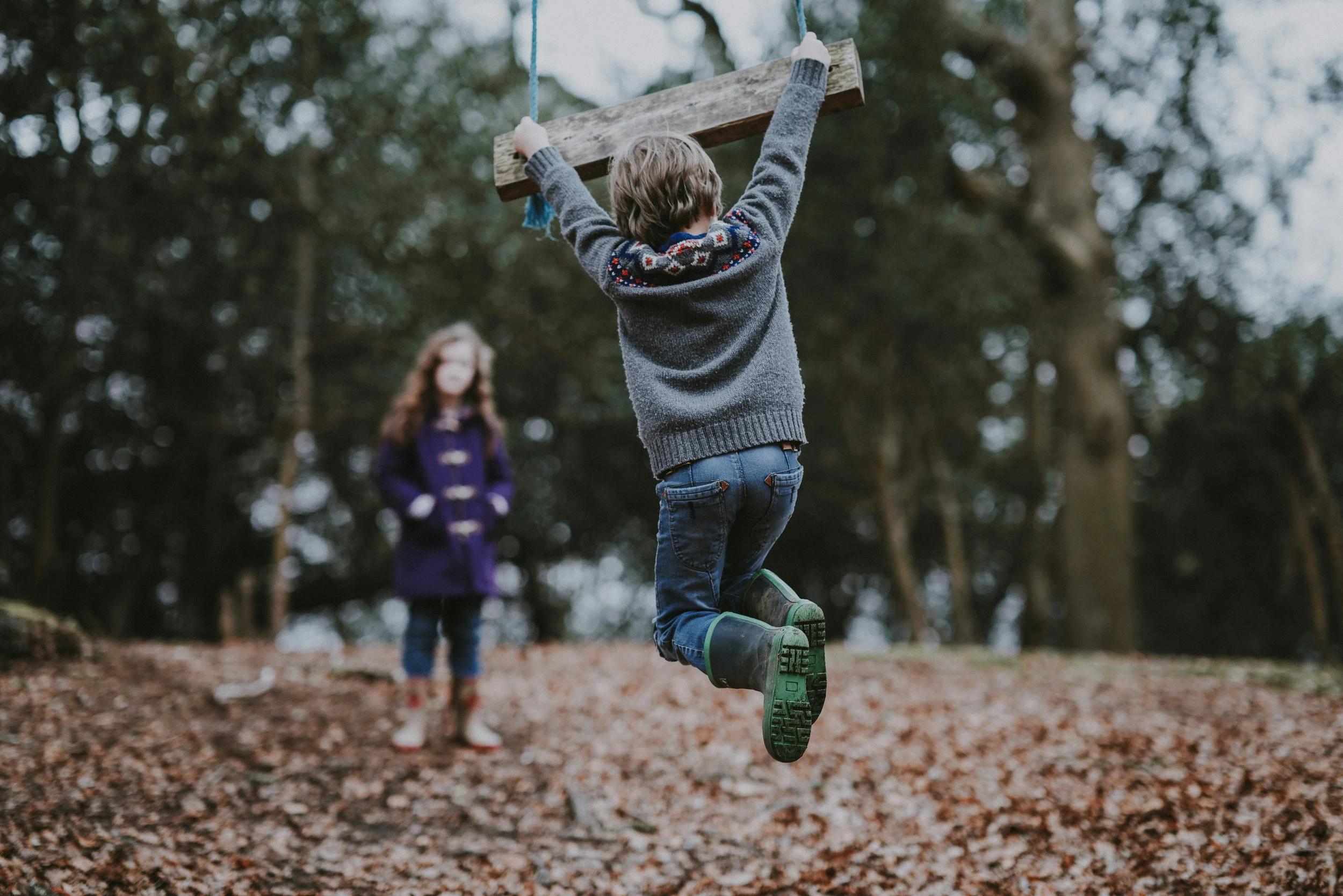 Child playing outdoors during free play, illustrating play-based childhood and healthy child development
