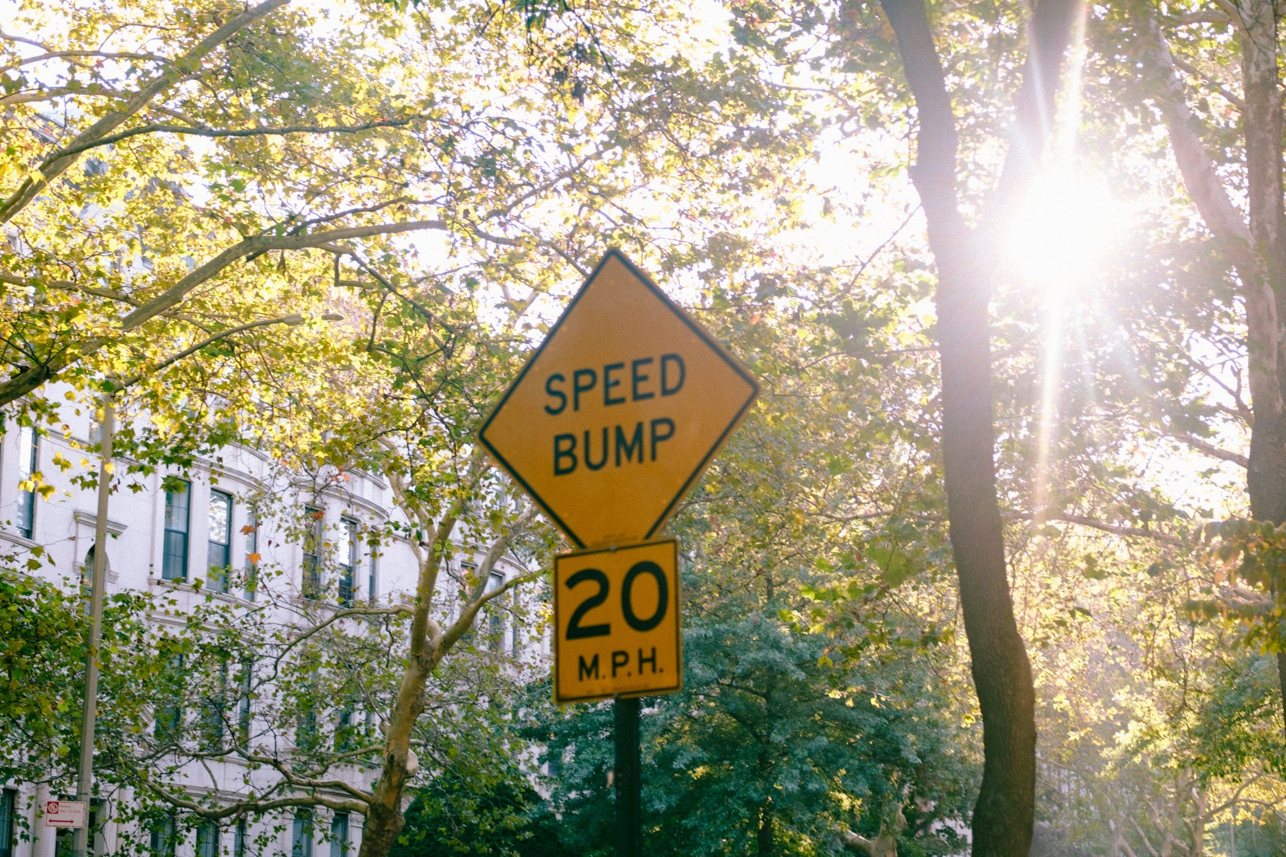 Yellow Speed bump sign. Emerge Counseling