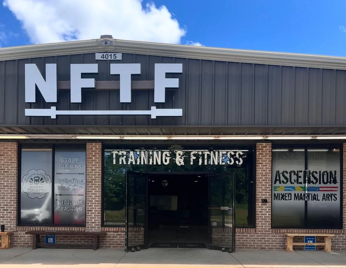 Secure, well-lit entrance at North Forsyth Training & Fitness in Cumming, GA, highlighting 24/7 access for members to work out anytime.