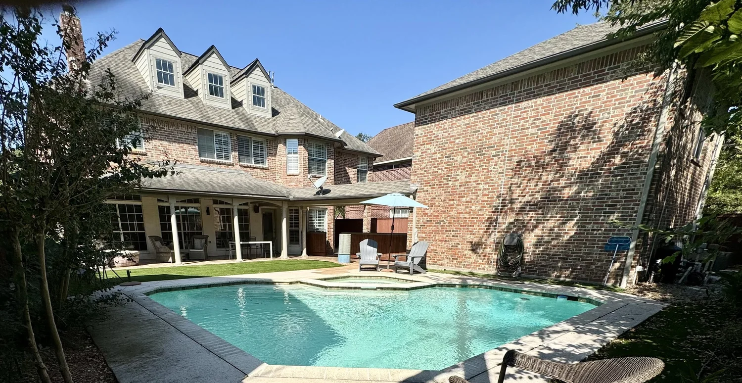 Exterior of Villa Capri, a five bedroom Luxurway house with a pool in the Bellaire area of Houston, Texas