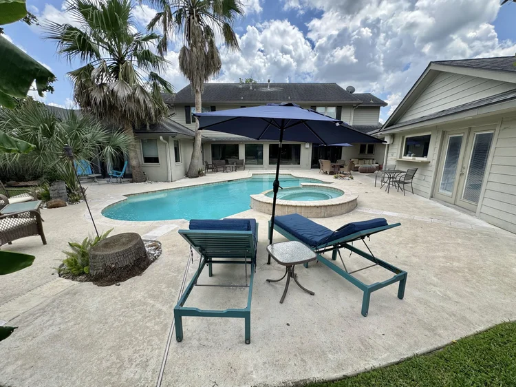 Exterior of Braes Mansion, a four bedroom furnished house with a pool in Meyerland, Houston