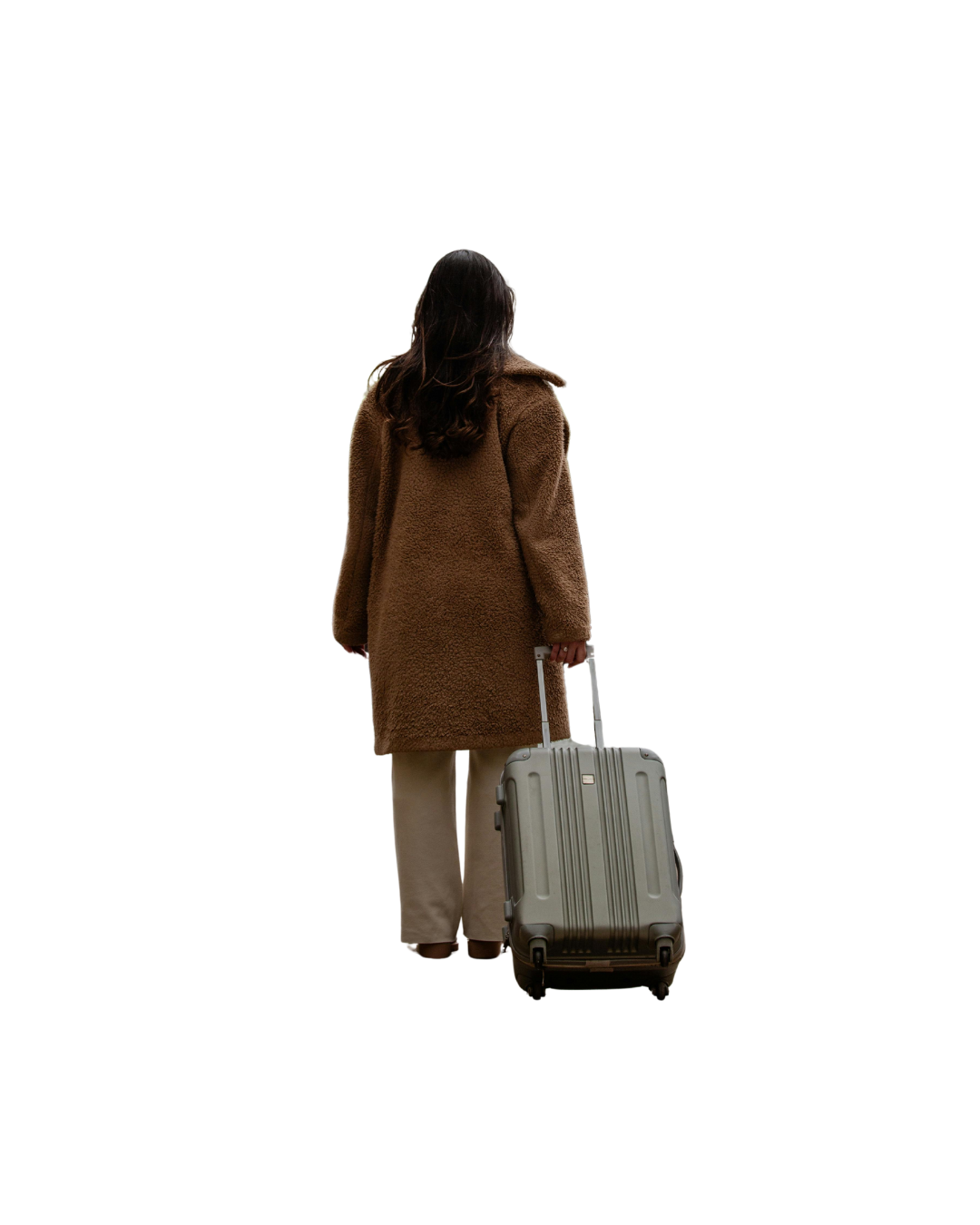 A woman sitting on a bed using a laptop with a dog lying next to her, sleeping on the bed.