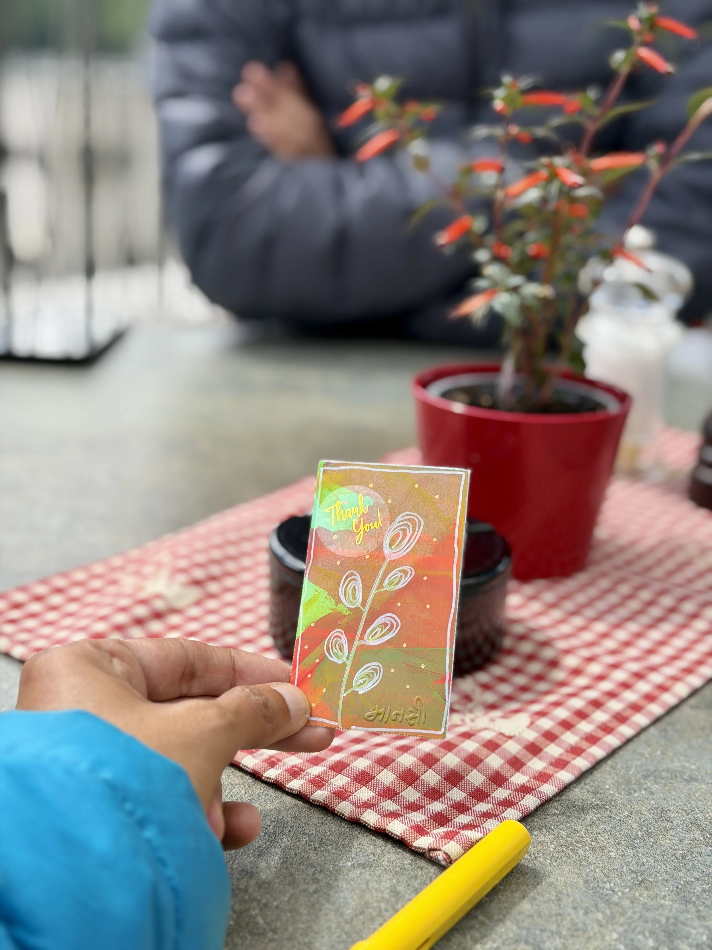 Small hand-painted note, given to a café server in Switzerland — Token Tales