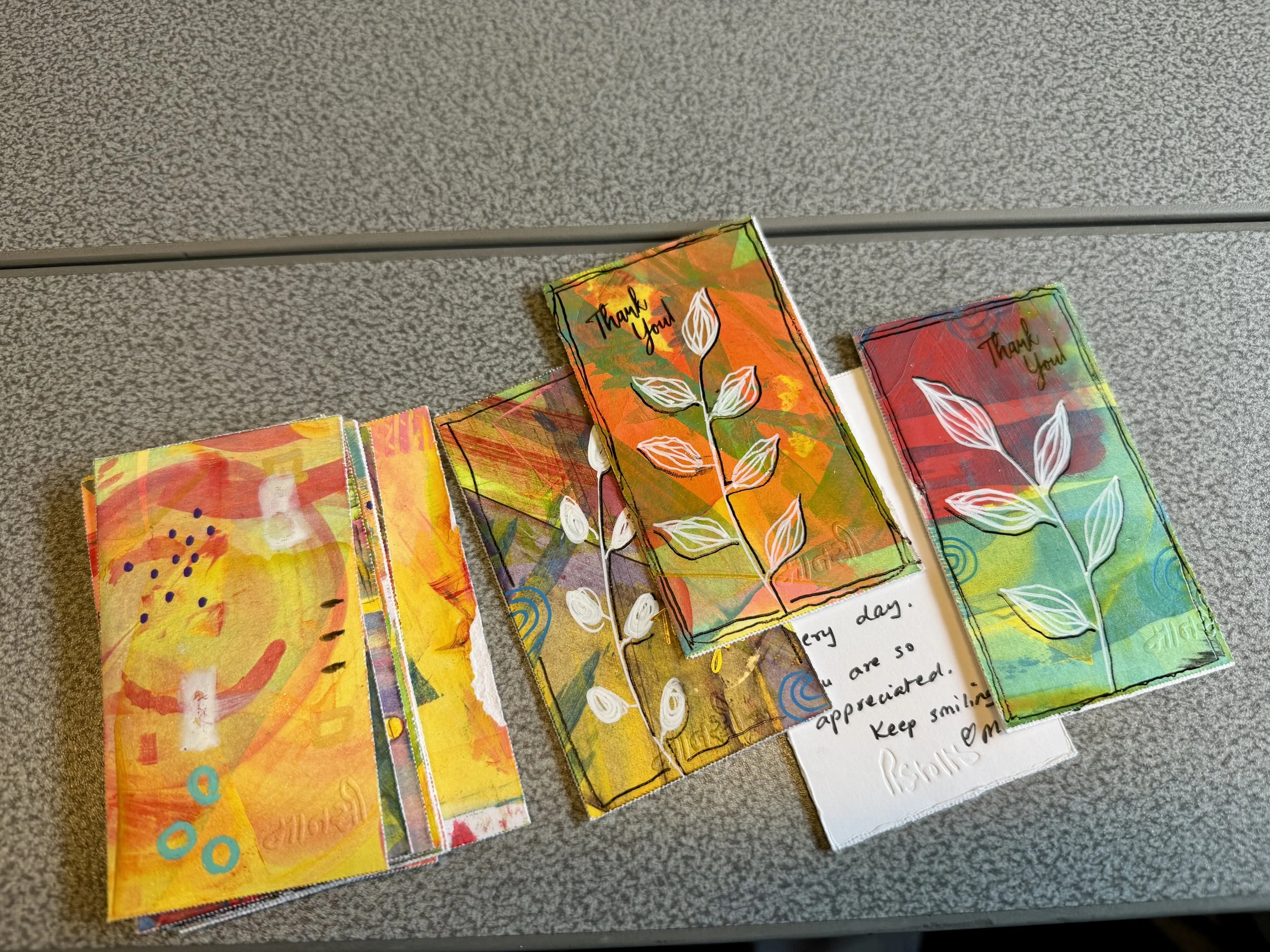 A selection of small hand-painted tokens, each with a handwritten note of thanks — Token Tales