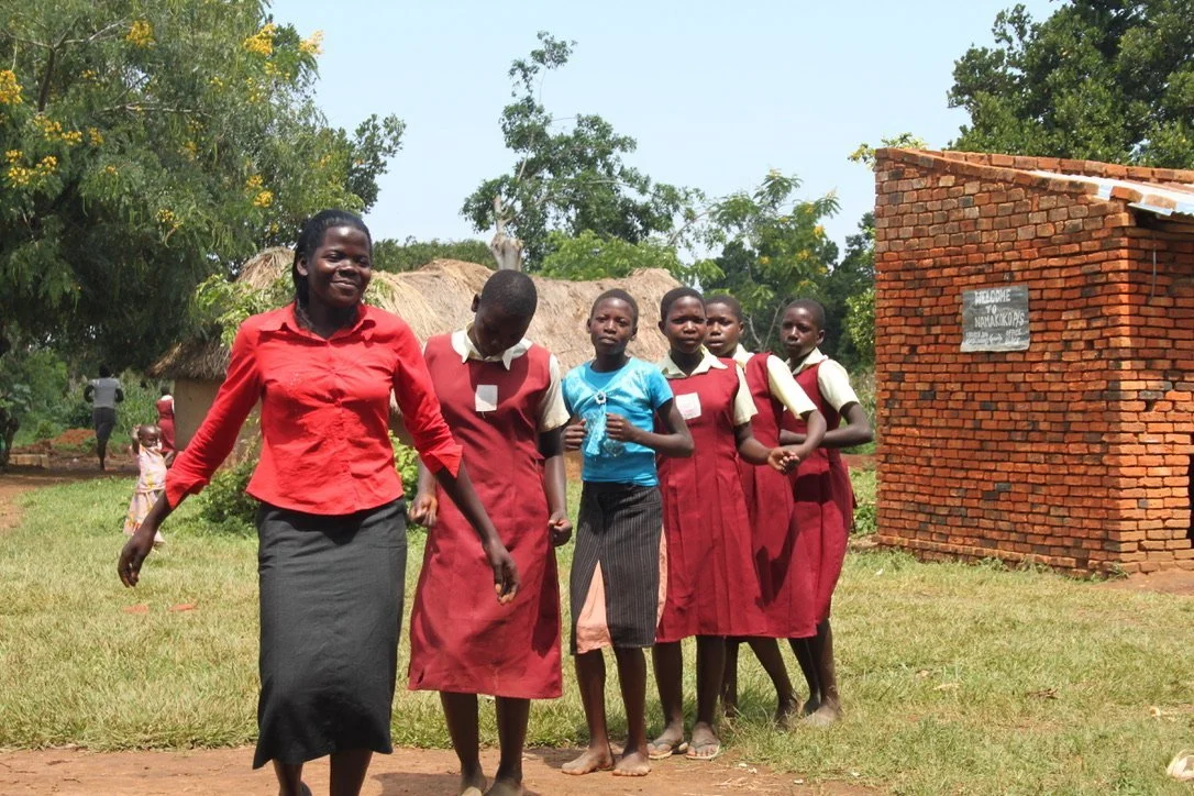 Staff and pupils in the grounds of Radnor House at Namokoko