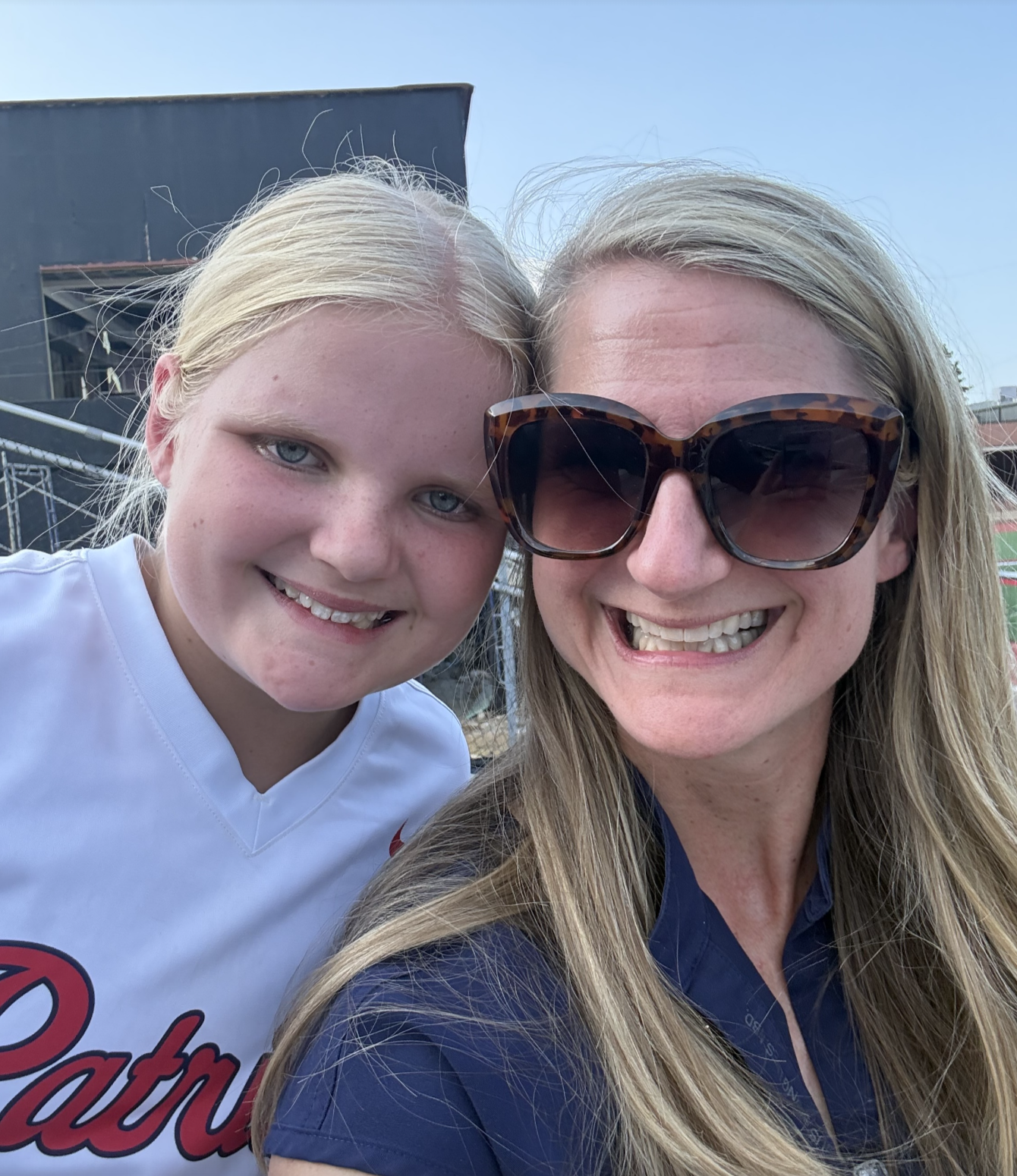 Jill smiling with her daughter after a workout