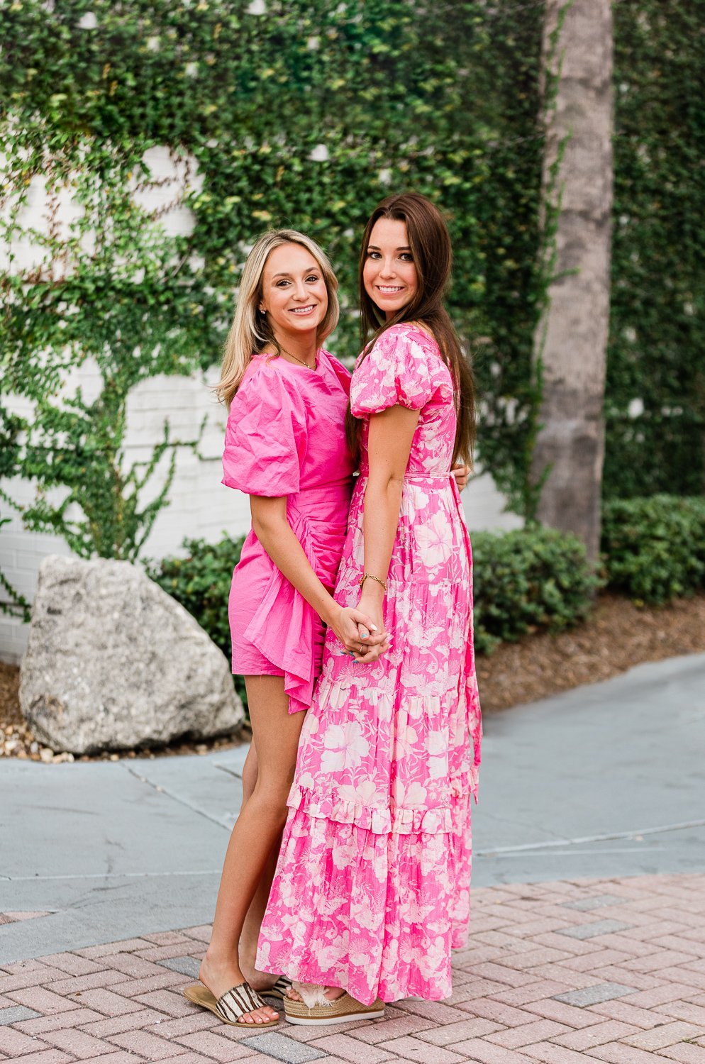Sisters wearing LoveShackFancy getting photographed together for senior and college grad photos in Ponte Vedra Beach