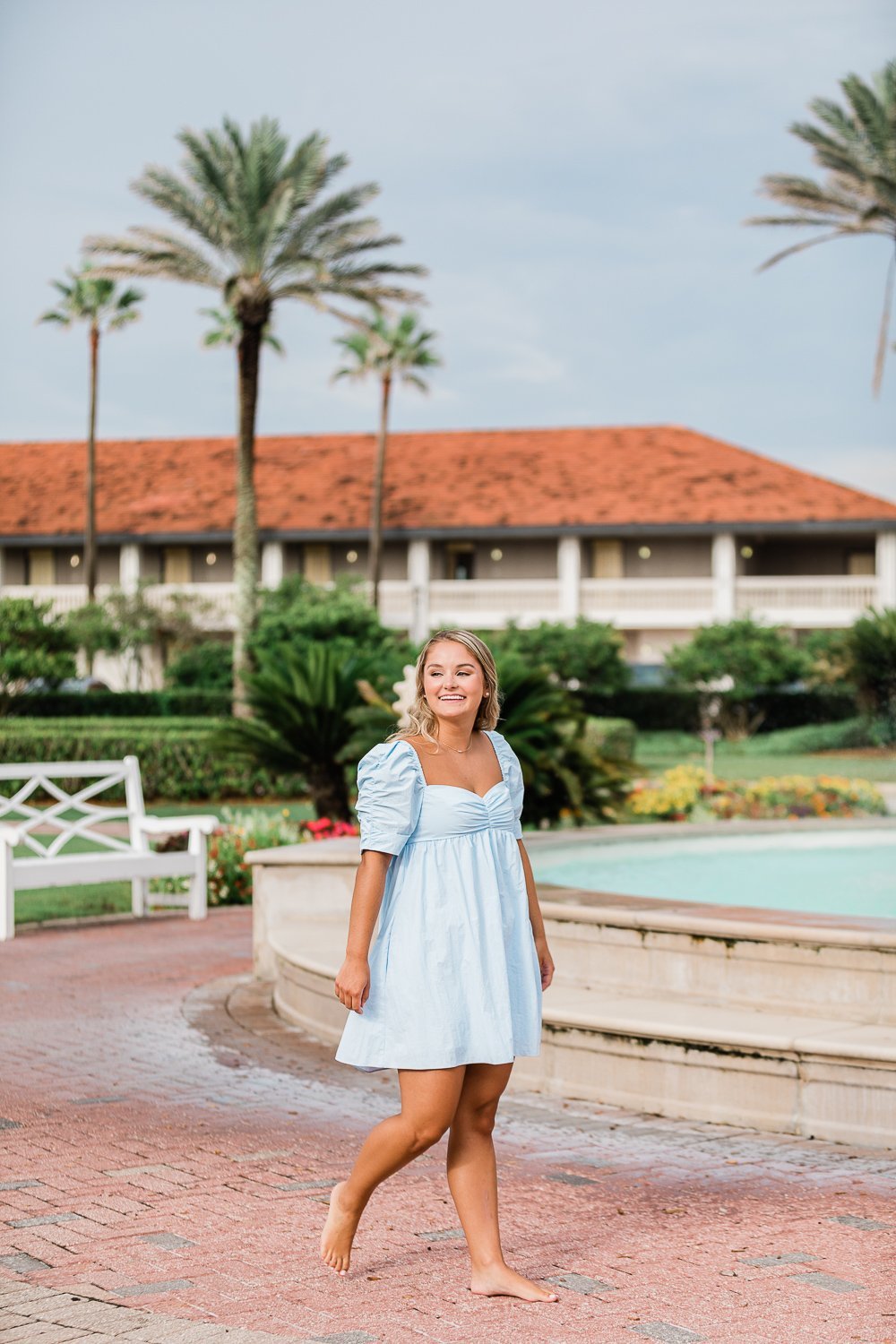 Senior pictures in Ponte Vedra Inn and Club with beautiful Florida background and palm trees