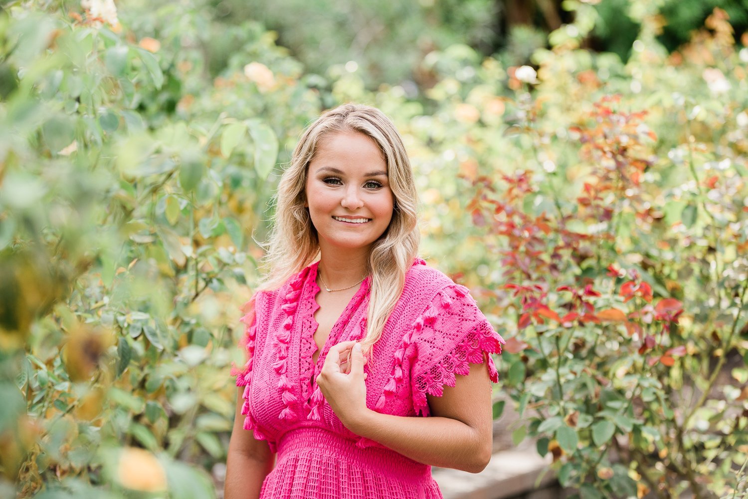 senior pictures in the rose garden in Washington Oaks