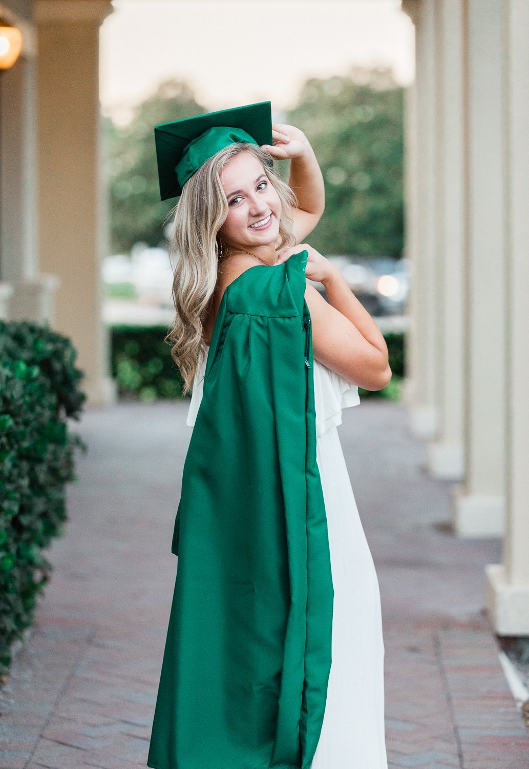 senior pictures with cap and gown in Nocatee Crosswater Hall