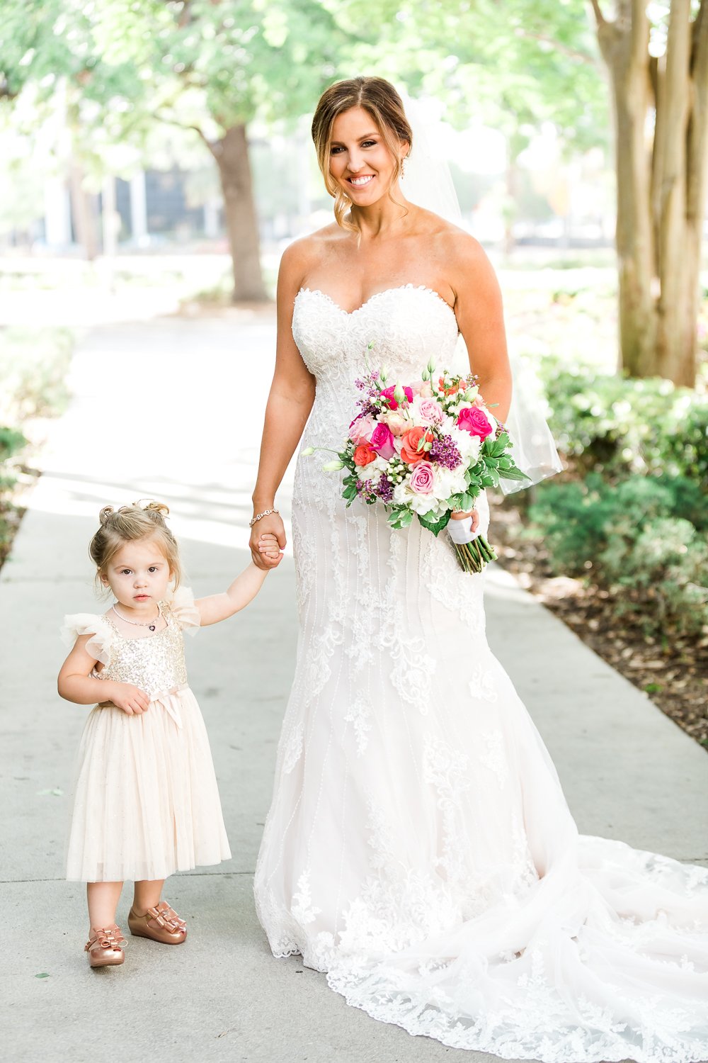 Bride with her little flower girl in Jacksonville, FL