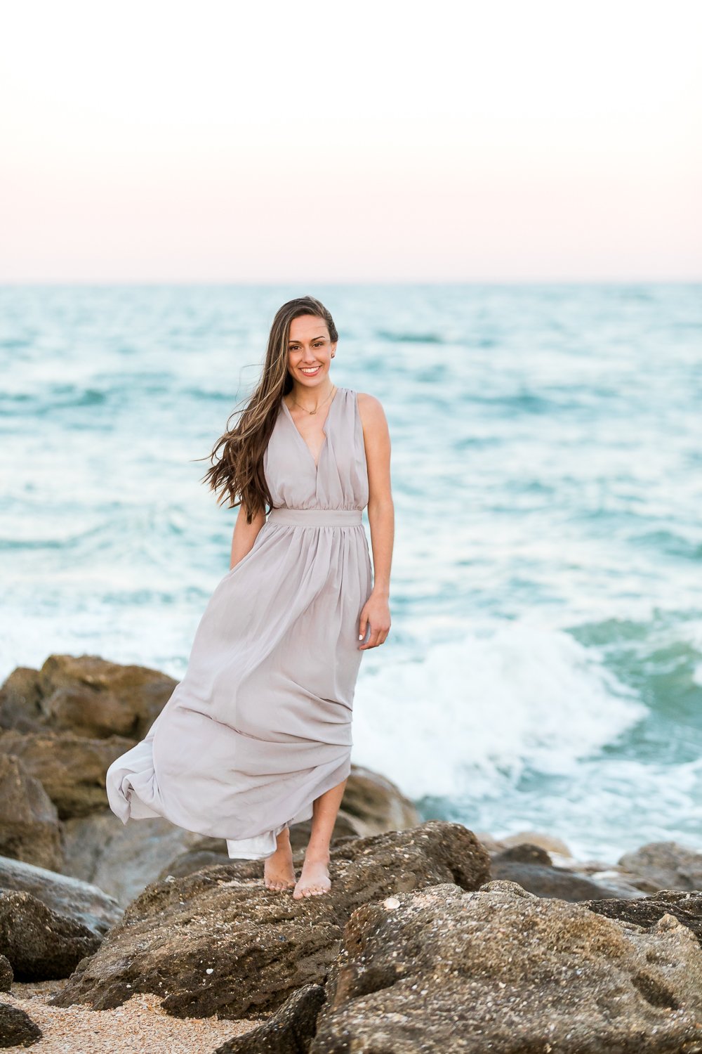 Picture and posing ideas for seniors at the beach during sunset