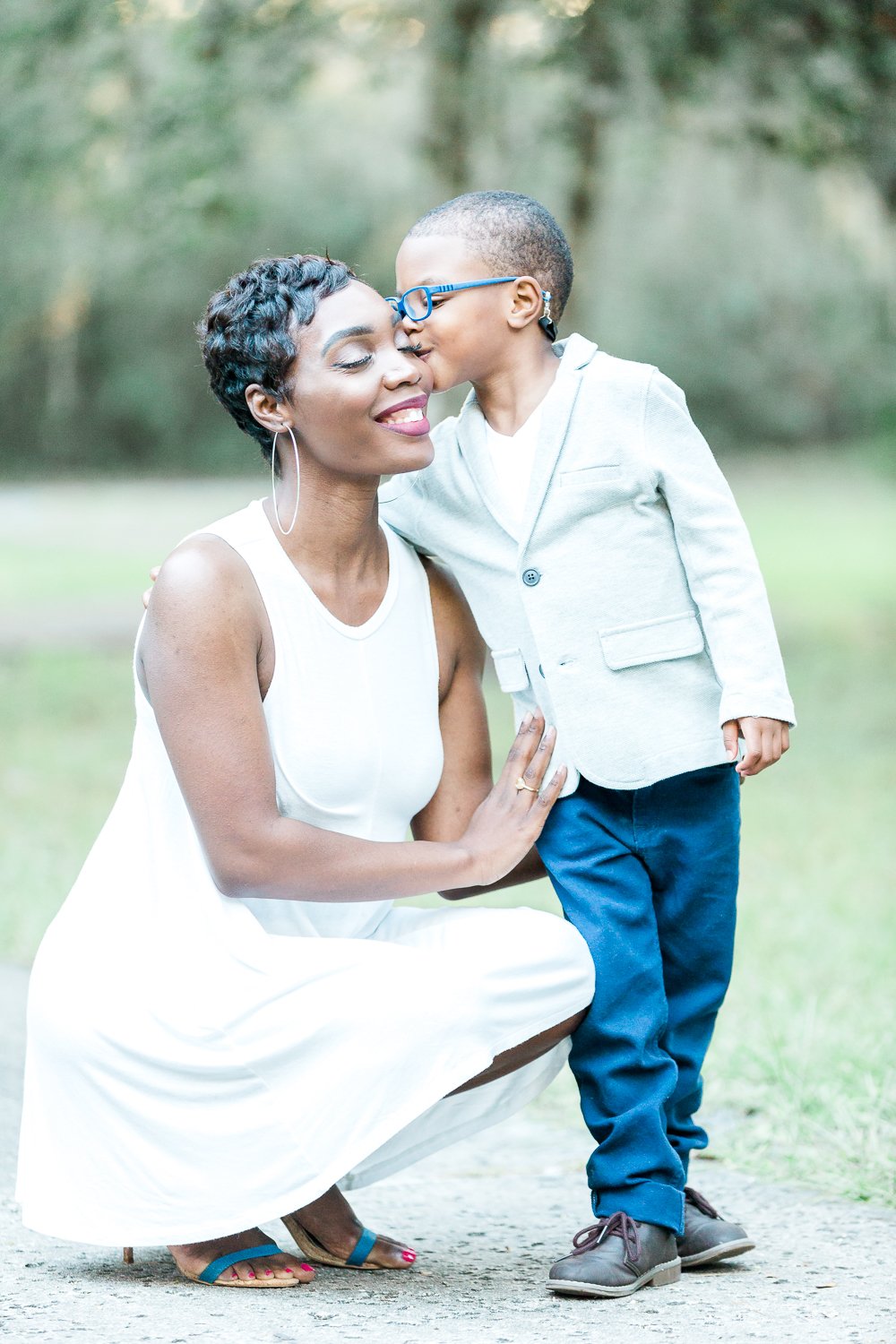 little boy kissing his mommy