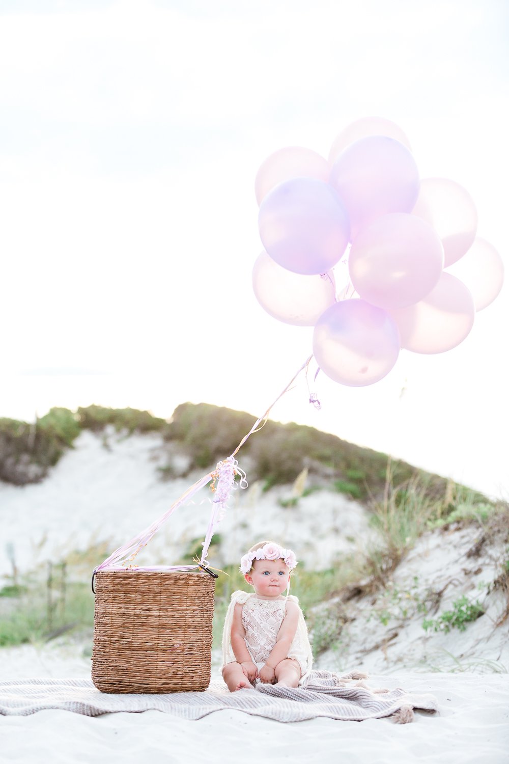 first birthday pictures at the beach with balloons