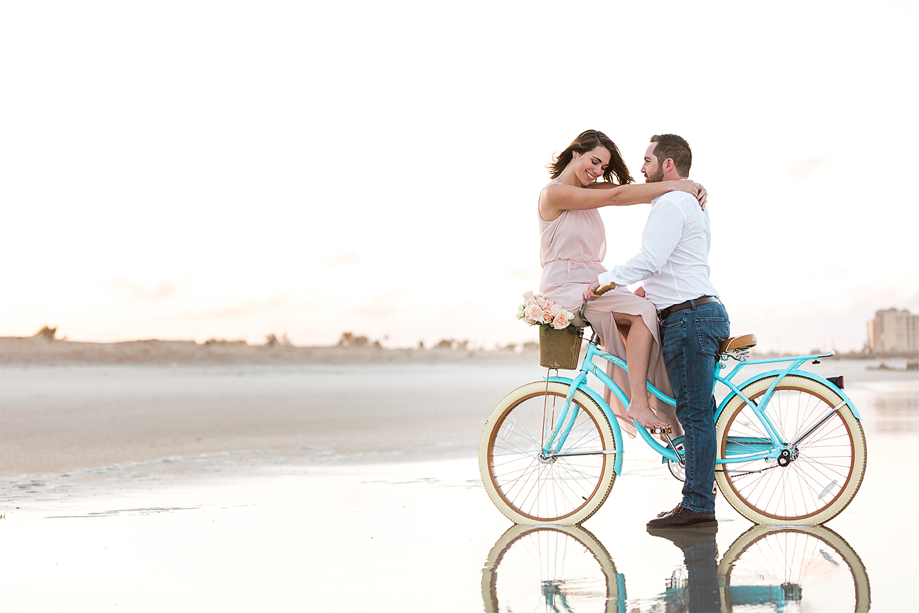 beach cruiser bike engagement pictures during sunset