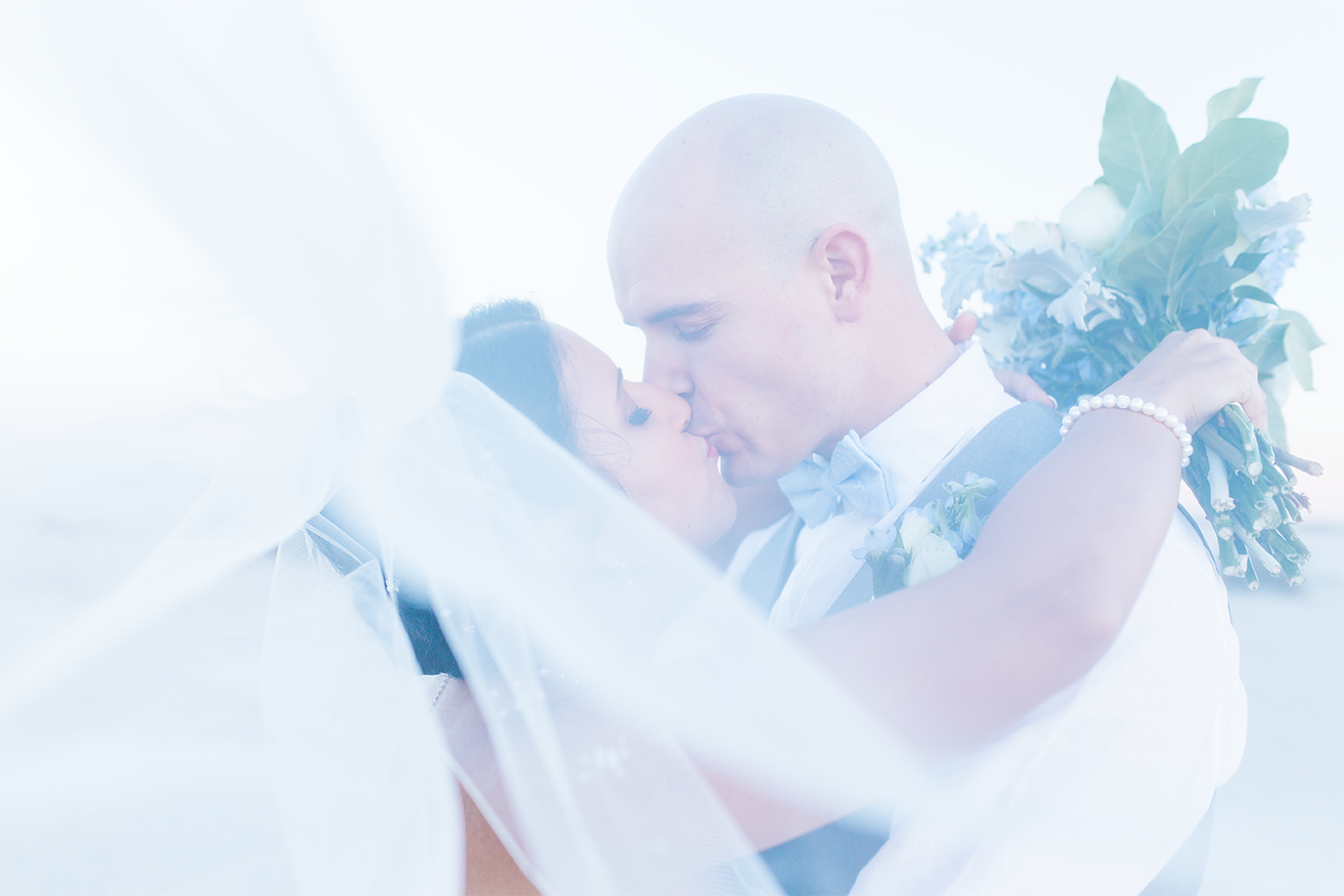 Wedding picture ideas | bride and groom kissing through the veil