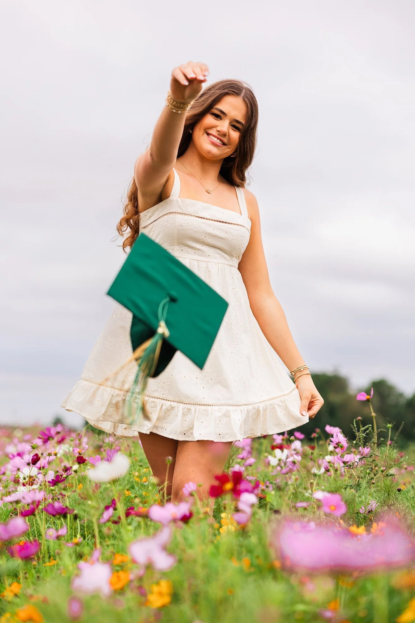 cap and gown picture ideas in a flower field near Ponte Vedra fl
