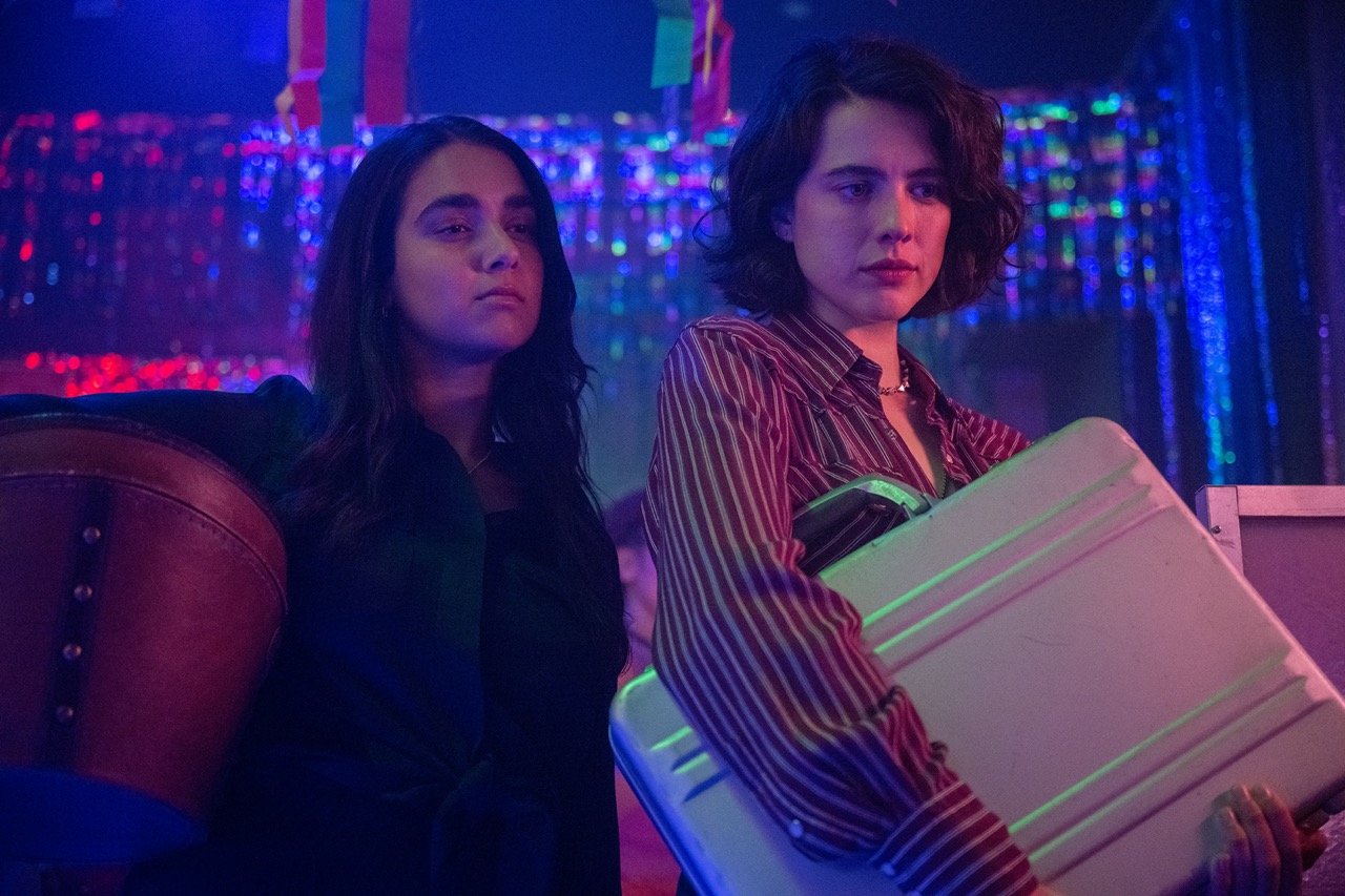 'Drive-Away Dolls' Review: Ethan Coen Waves Ally Flag With a Fun Lesbian Caper Worth Strapping Into