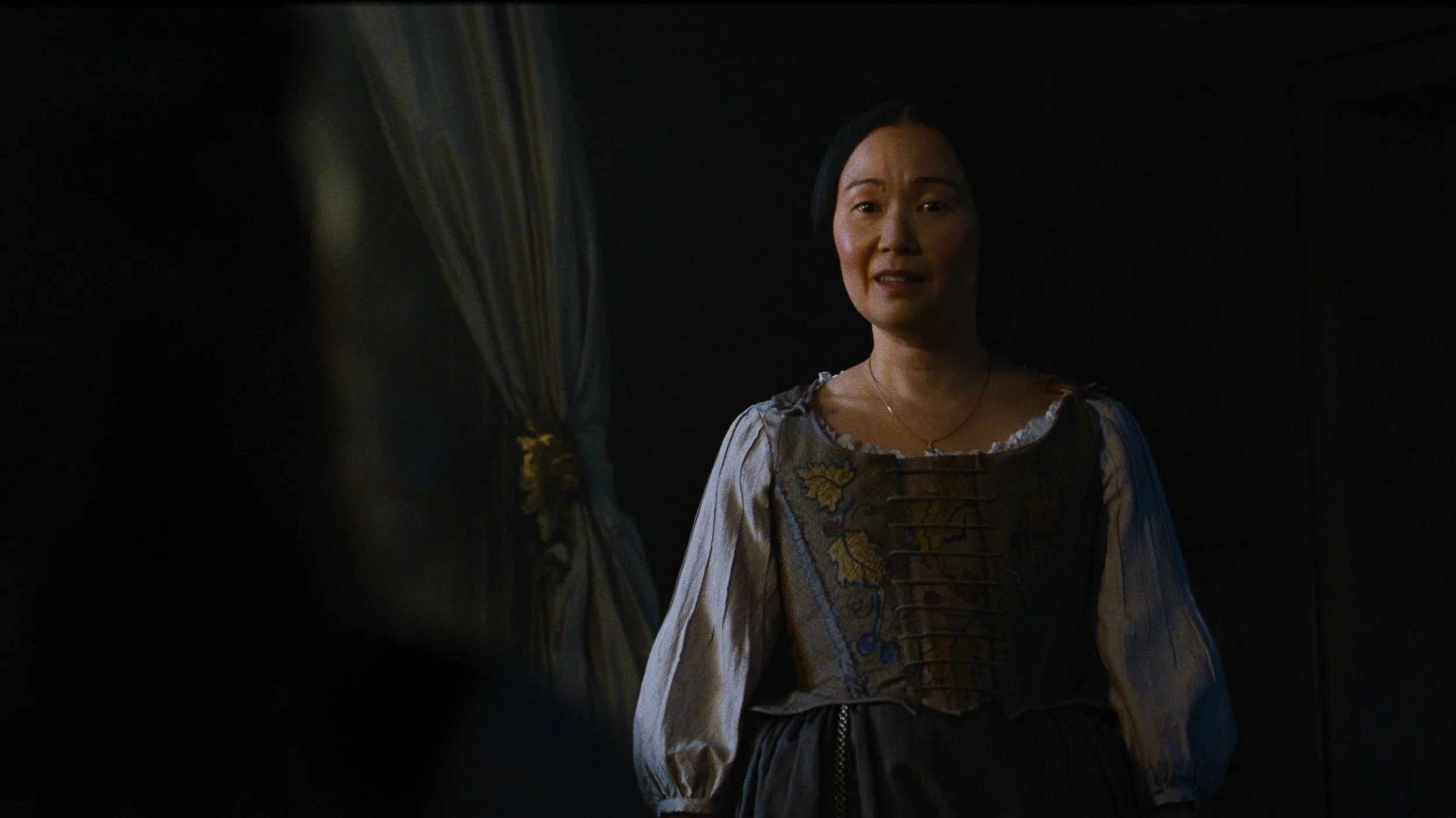 Caption: HONG CHAU as Nelly Dean in “Wuthering Heights,” a Warner Bros. Pictures Release.