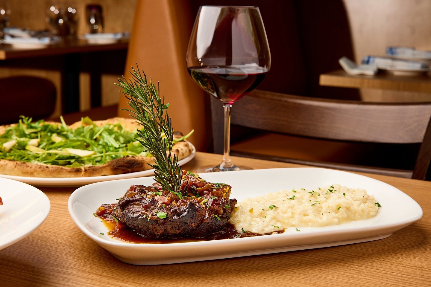 Savor the exquisite flavors of our most requested dish: Barolo Braised Veal Osso Buco with Risotto. Tender, succulent veal braised to perfection in rich Barolo wine, served alongside creamy risotto. A culinary masterpiece that will leave you craving 