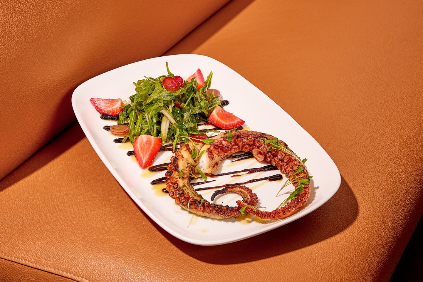 🌟 Highly recommend Chef&rsquo;s special: Grilled octopus drizzled with a heavenly balsamic and blood orange reduction, paired with a refreshing mixed green salad and vibrant fruits. A culinary masterpiece you won&rsquo;t want to miss! 🍽️✨ #GourmetD