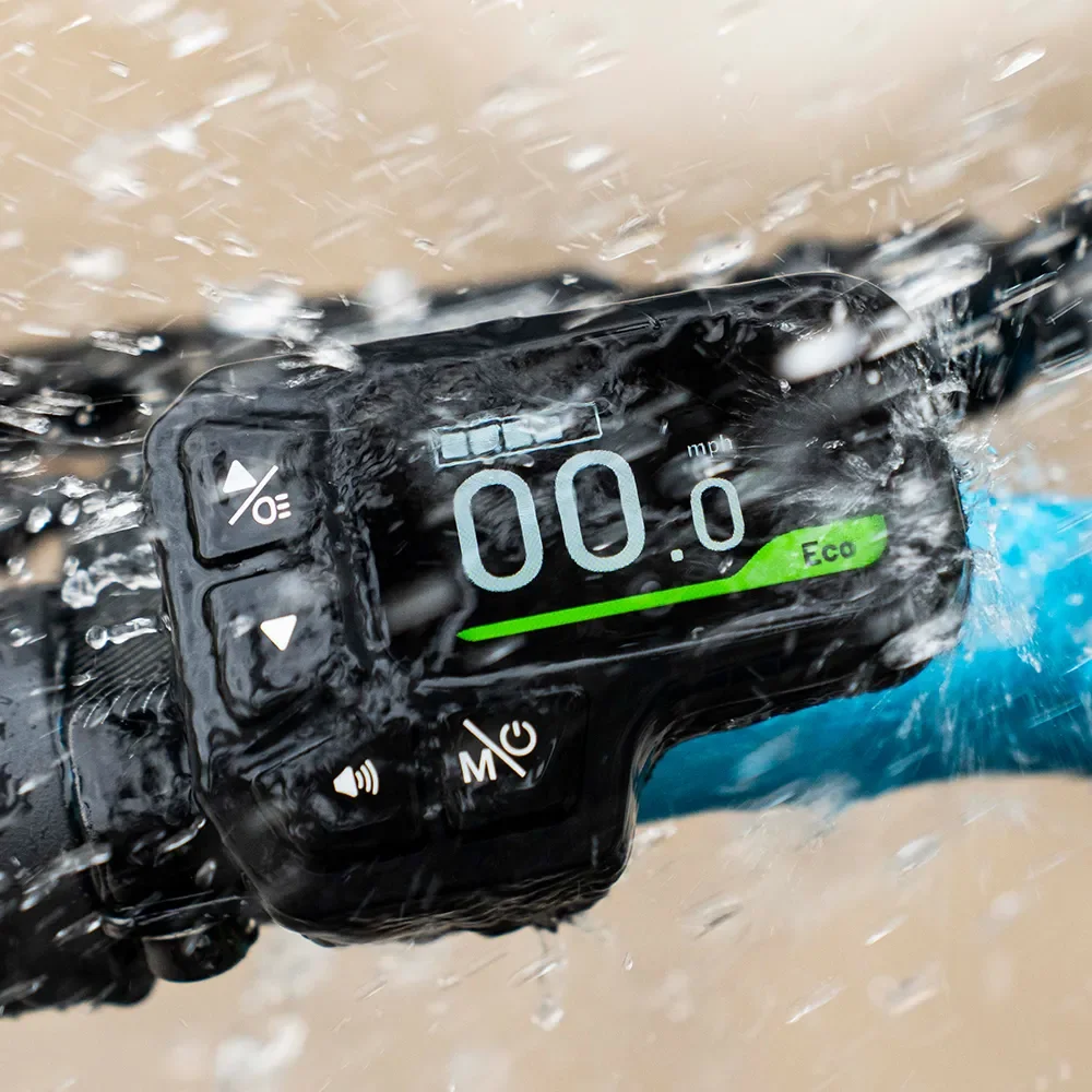 Fiido M1 Pro LCD display showing assist level, speed, and battery status in wet conditions