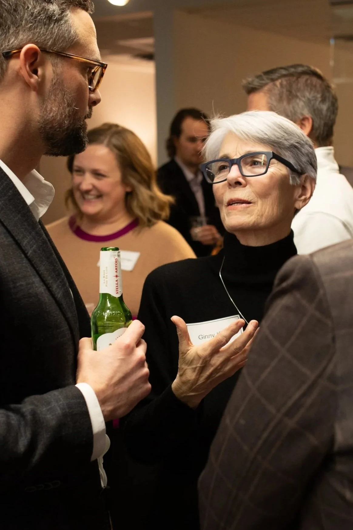 Professional Woman leading conversation at corporate event