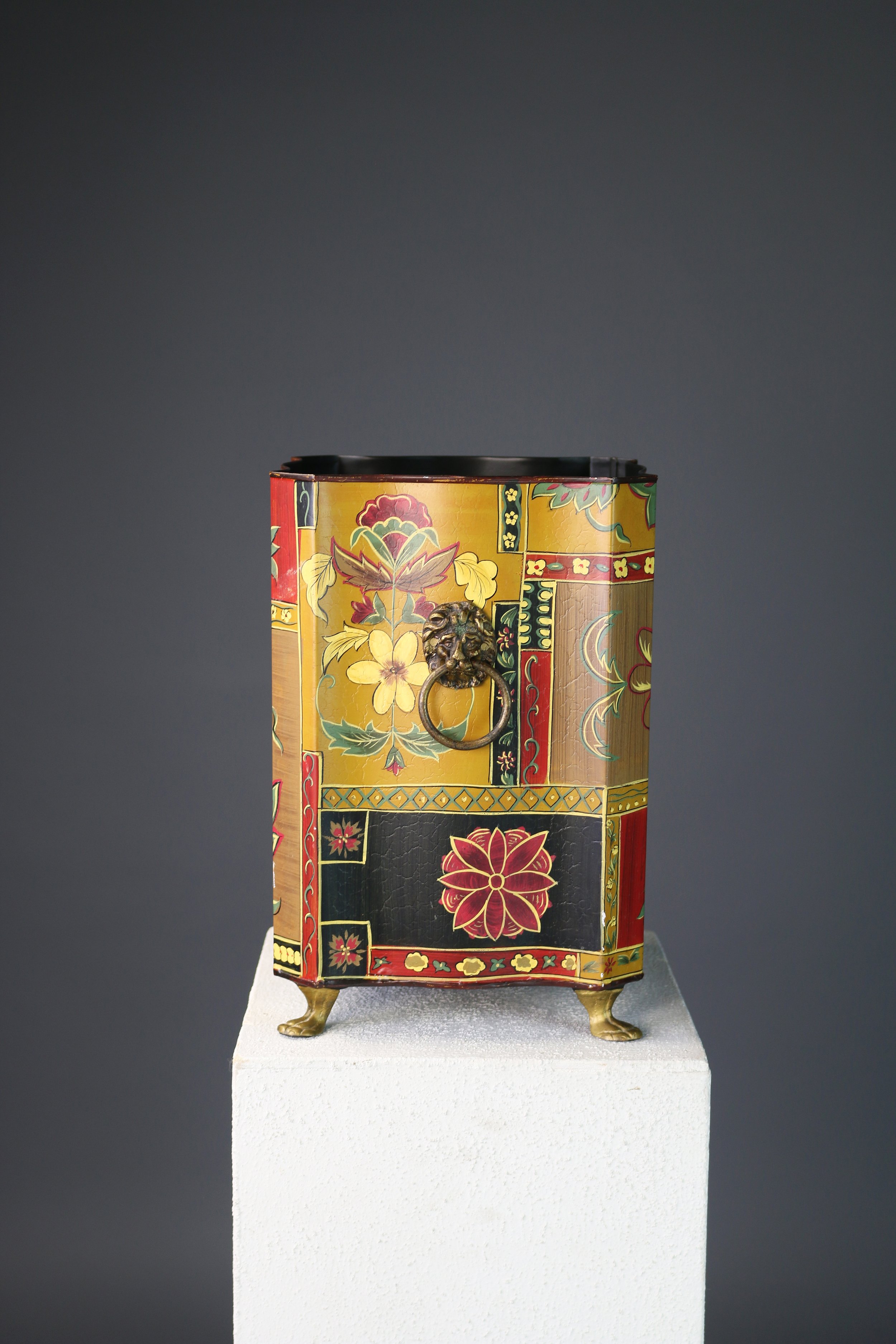 "Chinoiserie French Empire style metal bin with brass paw feet and lion head handles