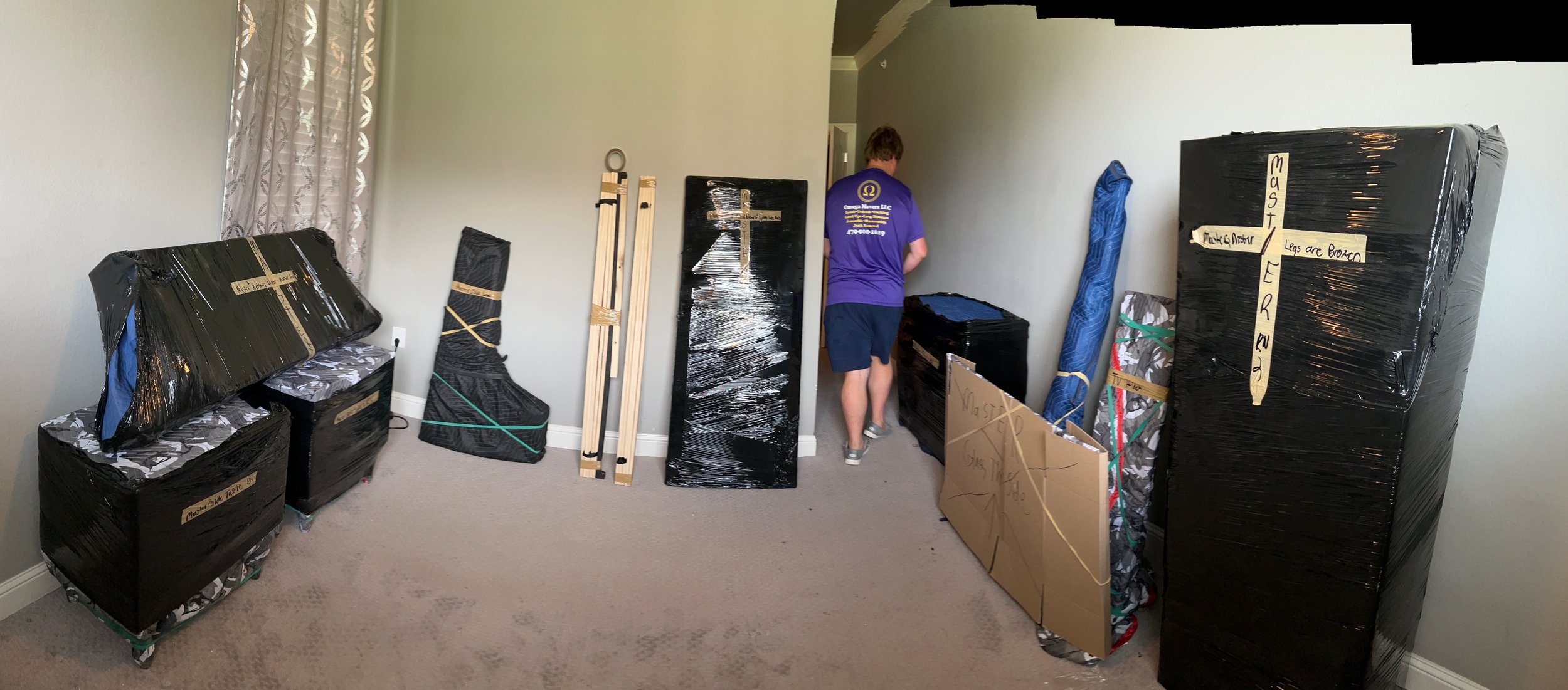 Furniture and personal belongings are packed and ready to be loaded into the moving truck