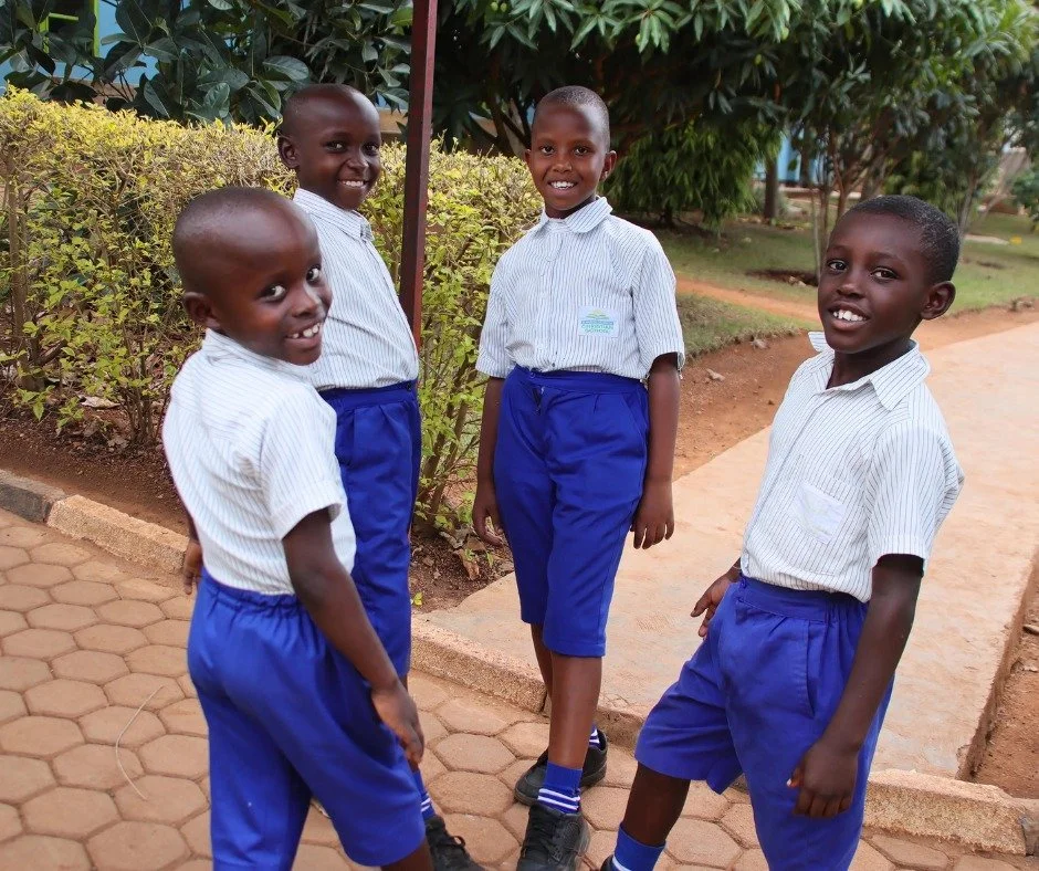 Happy Friday! These four friends are discussing the day ahead of them at RCCS. They are ready to tackle the classroom and its challenges, but are excitedly anticipating their favorite time of the week: Friday afternoon sports!