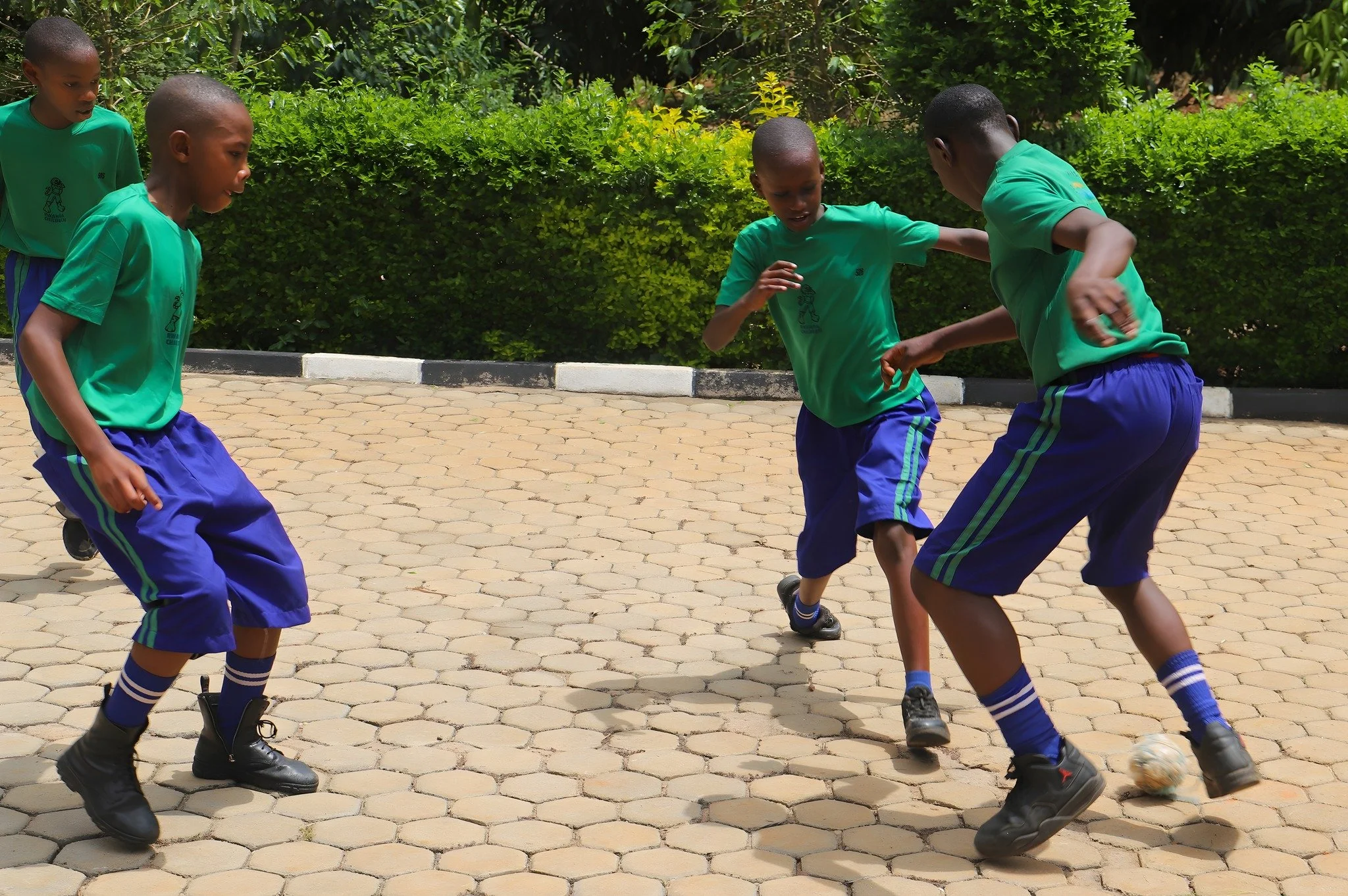 All it takes is some balled-up banana leaves and a little imagination to turn one of the broad sidewalks on our campus into a soccer field! During recess, our RCCS students quickly find ways to have fun and burn off excess energy.