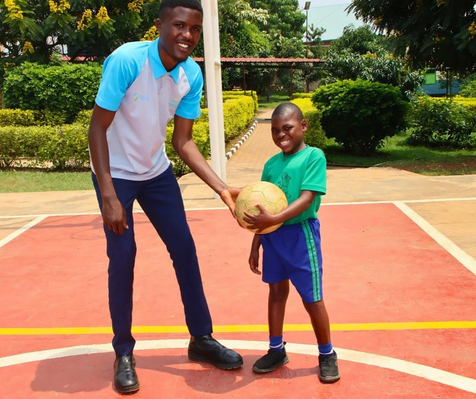Sometimes, the most important lesson of the day isn&rsquo;t in a classroom.

Aristophone Igiraneza&mdash;one of our Physical Education teachers&mdash;takes a few extra minutes to give Nicole some one-on-one guidance, helping her learn the basics of s
