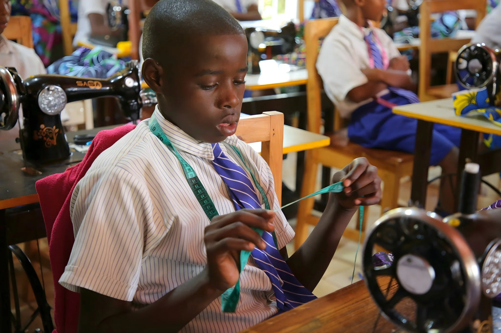 Stitch by stitch, a skill for life.

Bruno and his classmates at RCCS Primary are learning the basics of sewing&mdash;measuring, threading, and creating with care. What starts with simple skills, like repairing a seam or sewing on a button, is buildi