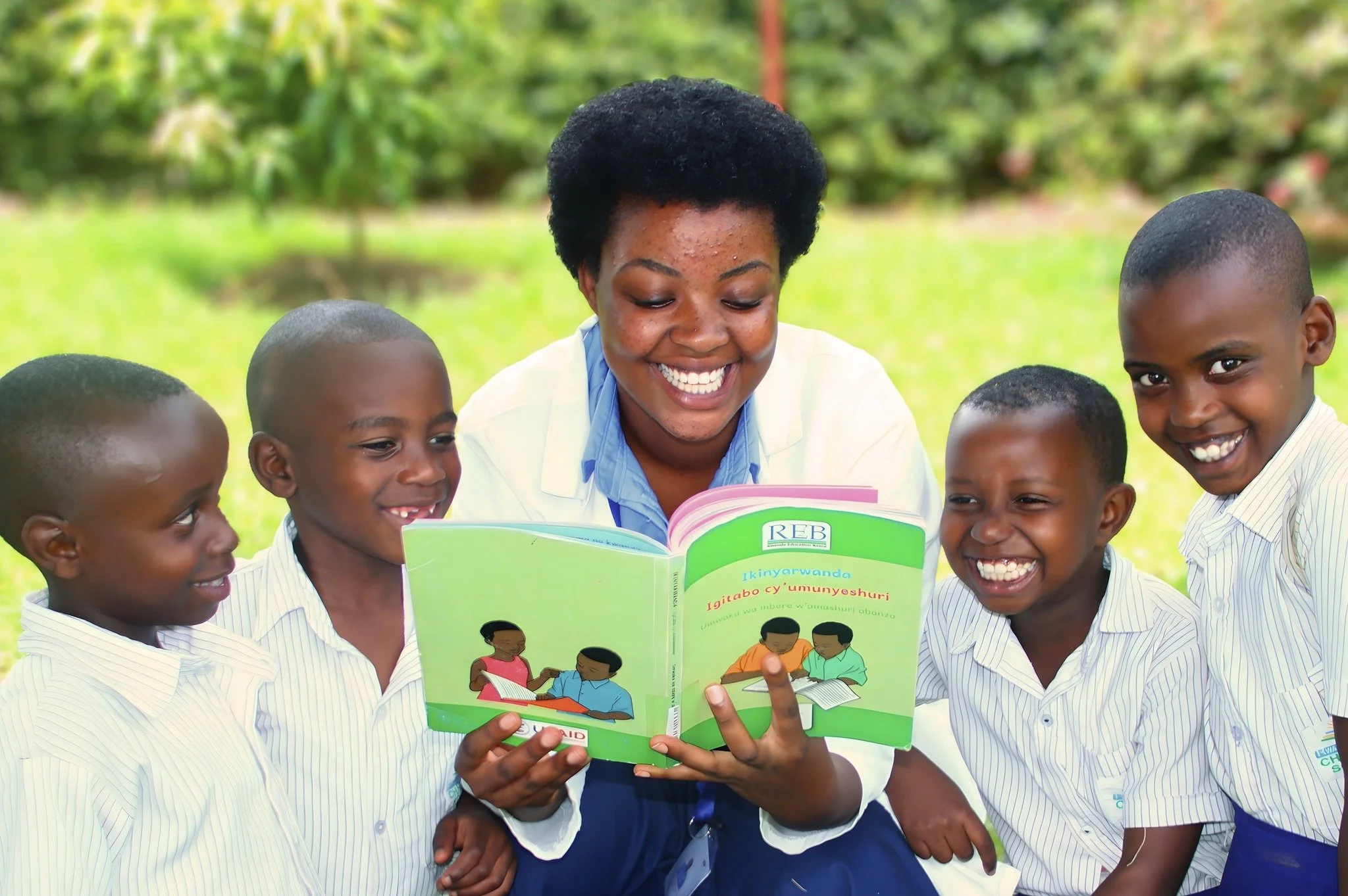 A good book brings everyone together.

RCCS teacher Odile Mukeshimana shares a story with her students&mdash;and you can see it in every smile. She's enjoying it just as much as they are.

Moments like this are where a love of reading begins.

Our li