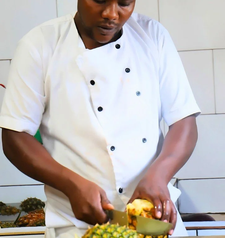 Meet Jean de Dieu Nshimiyimana.

Today, he&rsquo;s preparing fresh pineapple for lunch&mdash;harvested just yesterday from our campus farm.

He&rsquo;s one of more than 200 Rwandan staff members whose daily work helps sustain Rwanda Children from wit