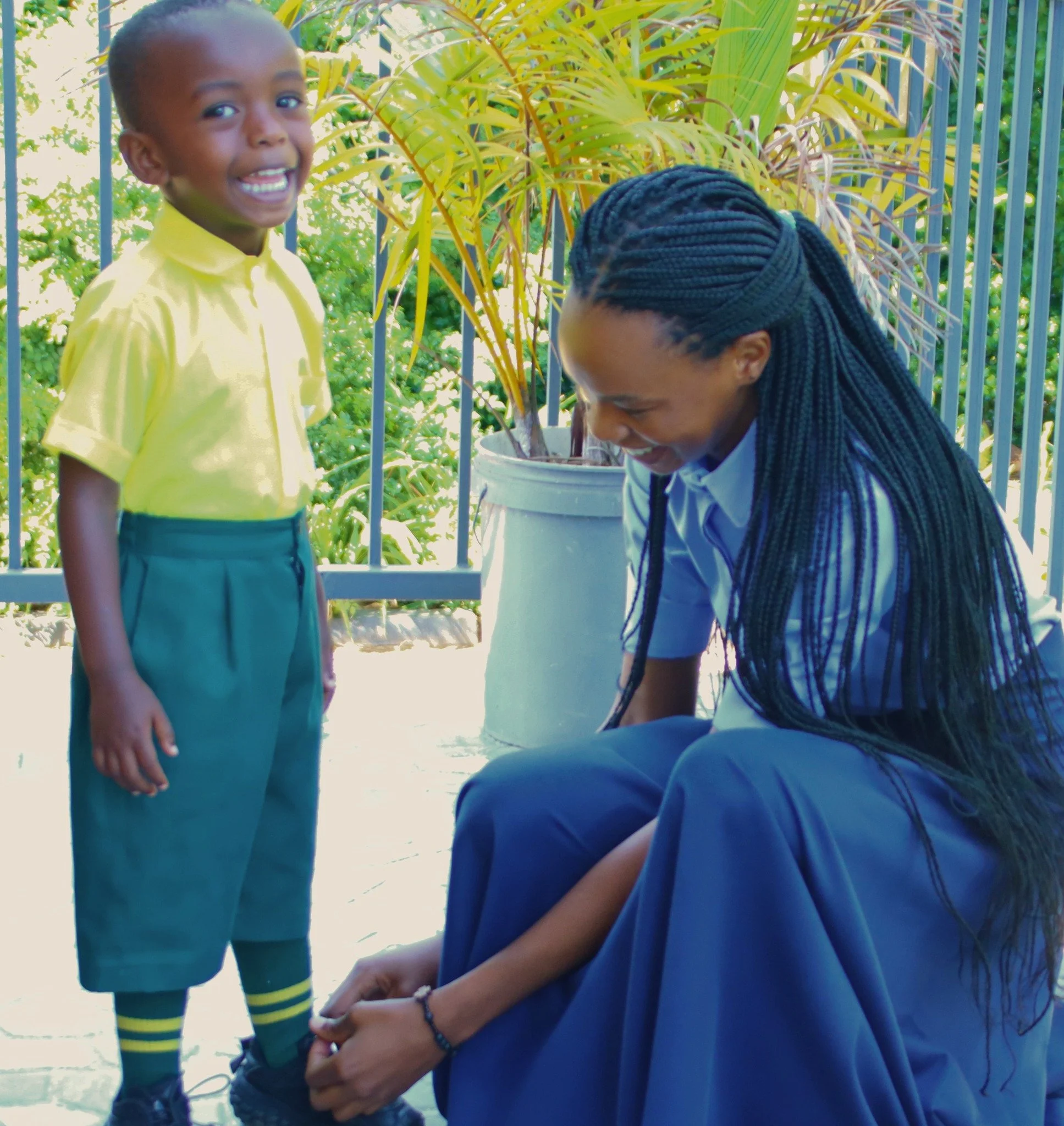 Mireille, one of our RCCS teachers, was on her way to class when she noticed Emmy&rsquo;s shoes were untied.

She was in a hurry. She stopped anyway.

She knelt down to tie his laces, looked up at him &mdash; and Emmy, three years old, smiled like sh