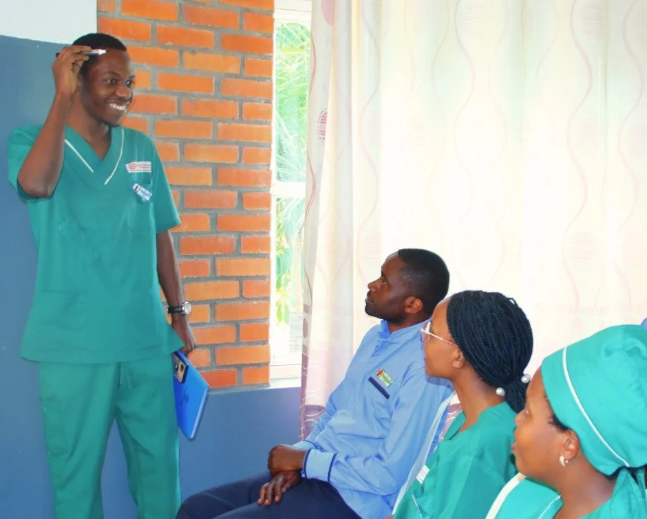 If you walked into our Health Center earlier this week, you wouldn't have found Egide Uwizera with a patient.

You would have found him at the front of the room.

One of our midwives, Egide, recently led a training session on childbirth for fellow me
