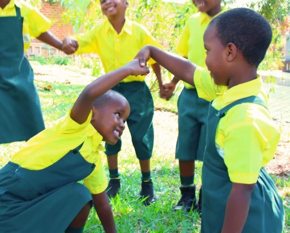 Her name is Keza.

She is 5 years old and is part of our Early Childhood Development program at Rwanda Children Christian School.

This week, one of her classmates fell during play.

Her name is Lica.

Keza stopped playing immediately. She helped Lic