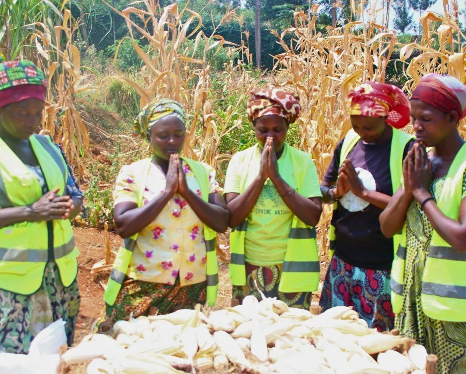 Four months of tending, and now&mdash;harvest.

Before a single ear of corn was carried home, Leocadie Mukamutara, Vincentia Nirere, and their fellow agricultural teammates paused to do something else first.

They stopped to thank God.

Gathering aro