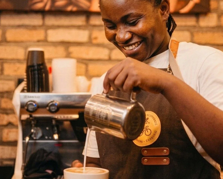 Diane knows how to pour a good vanilla latte.

She's a server at Yellow Elephant Coffee Shop and a former coach of our Bugesera Women's Cycling Team. This week, she was behind the counter making one of the drinks customers come back for.

&ldquo;Toda
