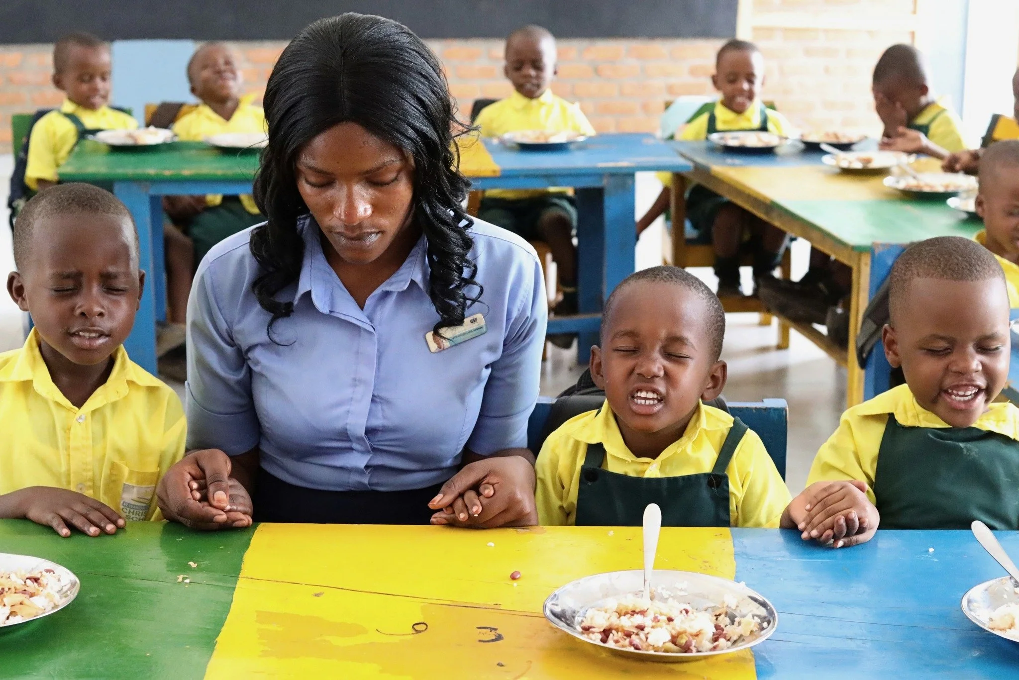 Before lunch in Nursery 3, there was one more thing to do.

Five-year-old Aniella joined hands with RCCS assistant teacher, Marie Solange Nyirahabimana, and her classmates Ange Paradis and Patric.

&ldquo;Thank you, God, for giving us this food and f