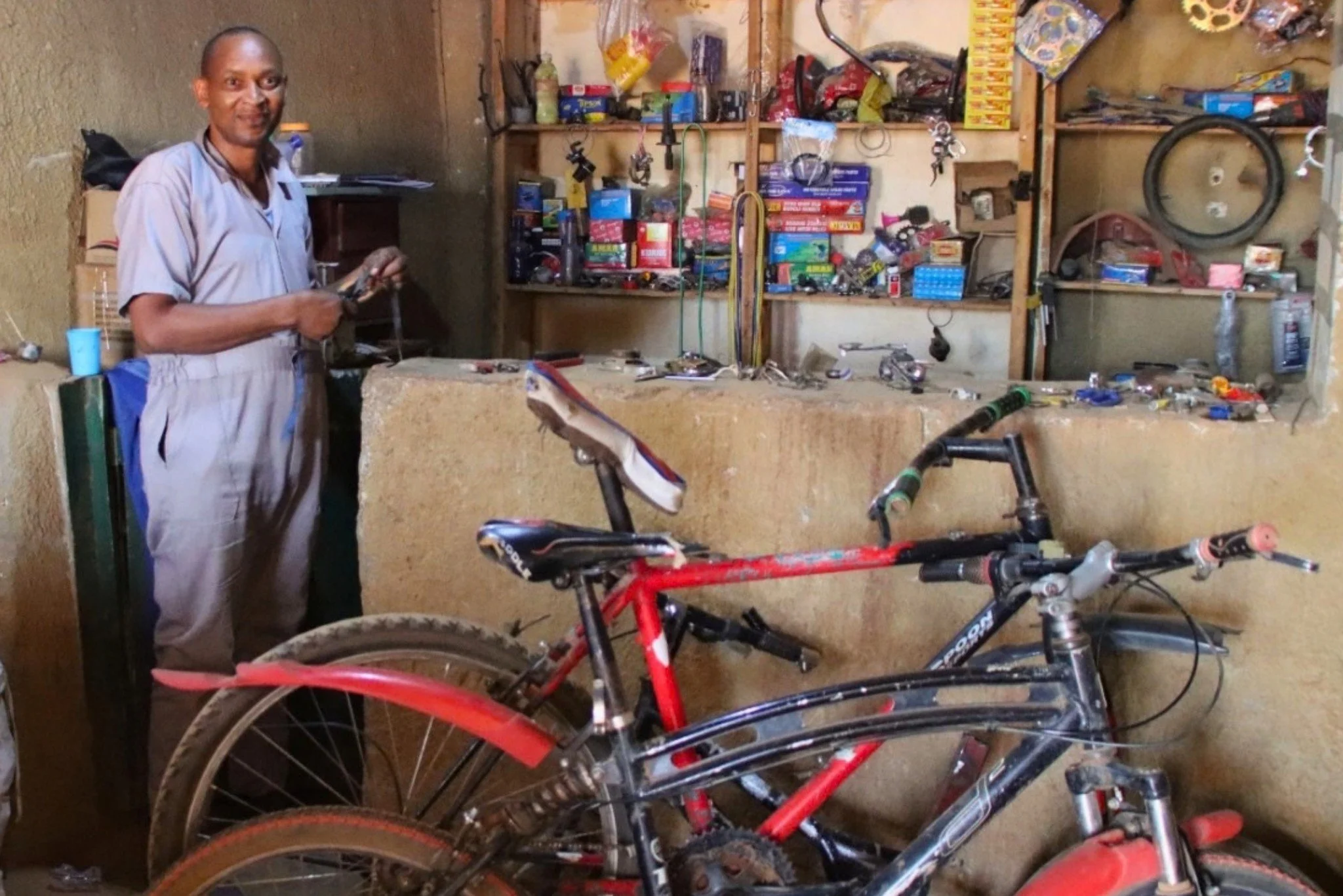 Lambert&rsquo;s bicycle repair shop is up and running.

He received an $827 loan through Rwanda Children&rsquo;s Family Transformation Microfinance Program to start the business and purchase the tools and equipment he needed.

The shelves behind him 