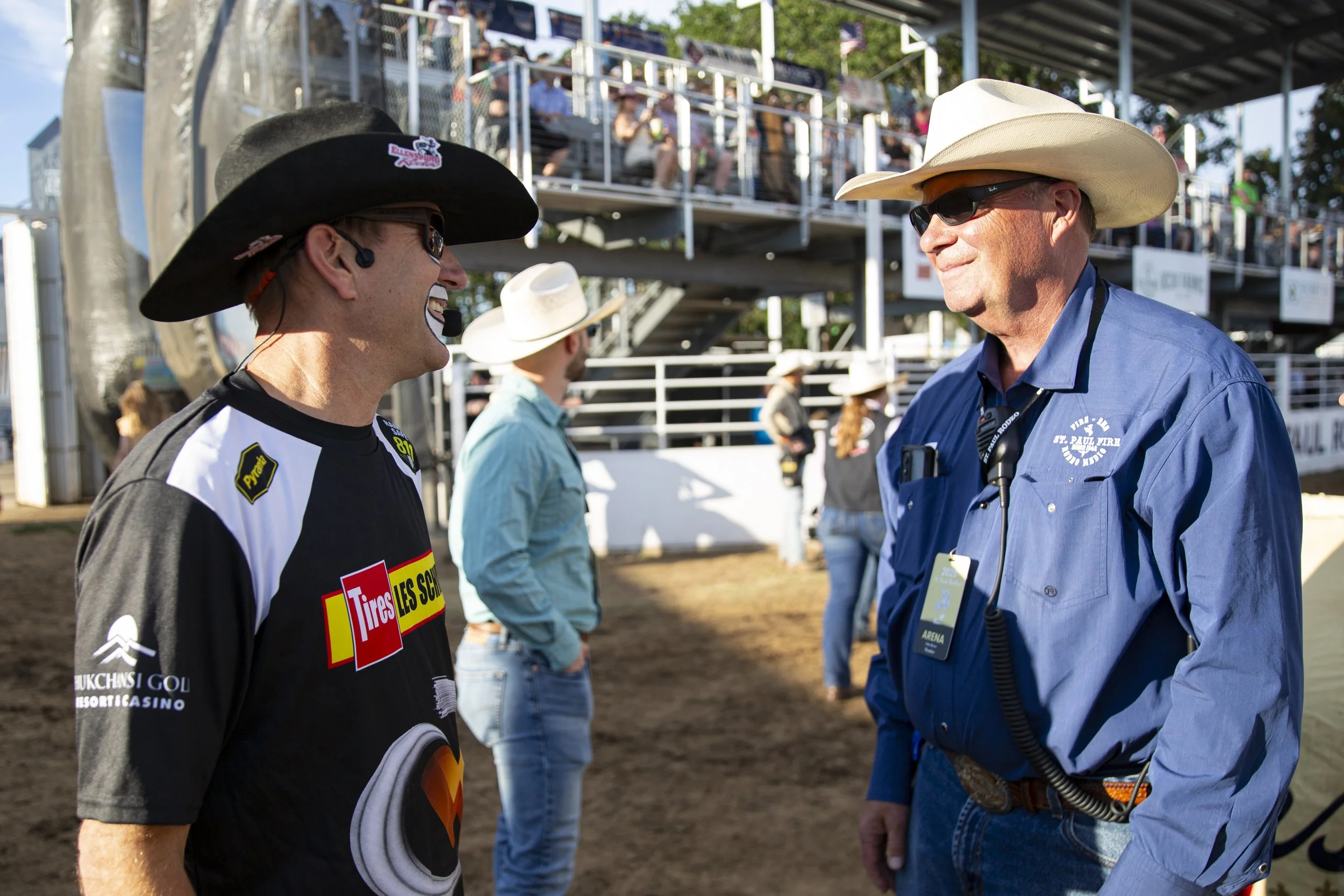 JJ Harrison, left, talks with volunteer medical worker Dr. John Heiser ahead of opening night.