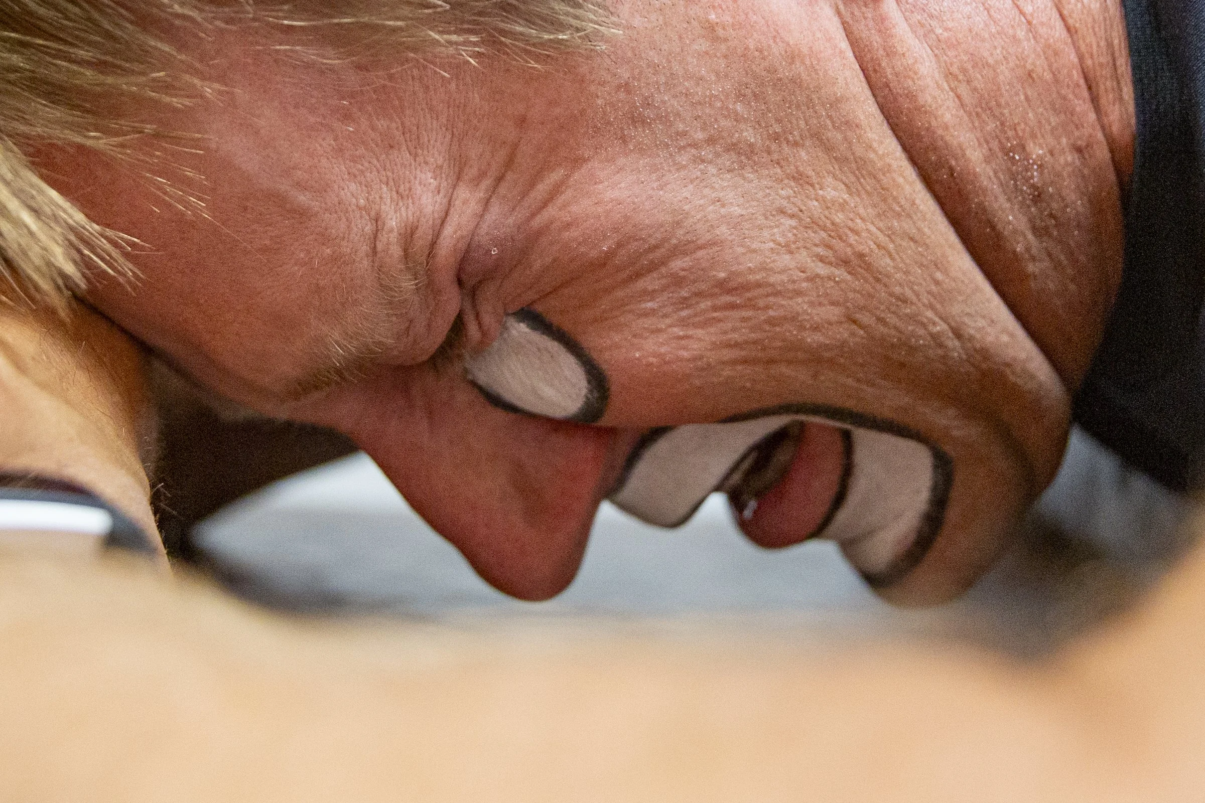 JJ Harrison grimaces in pain while undergoing electrode treatment before the rodeo.