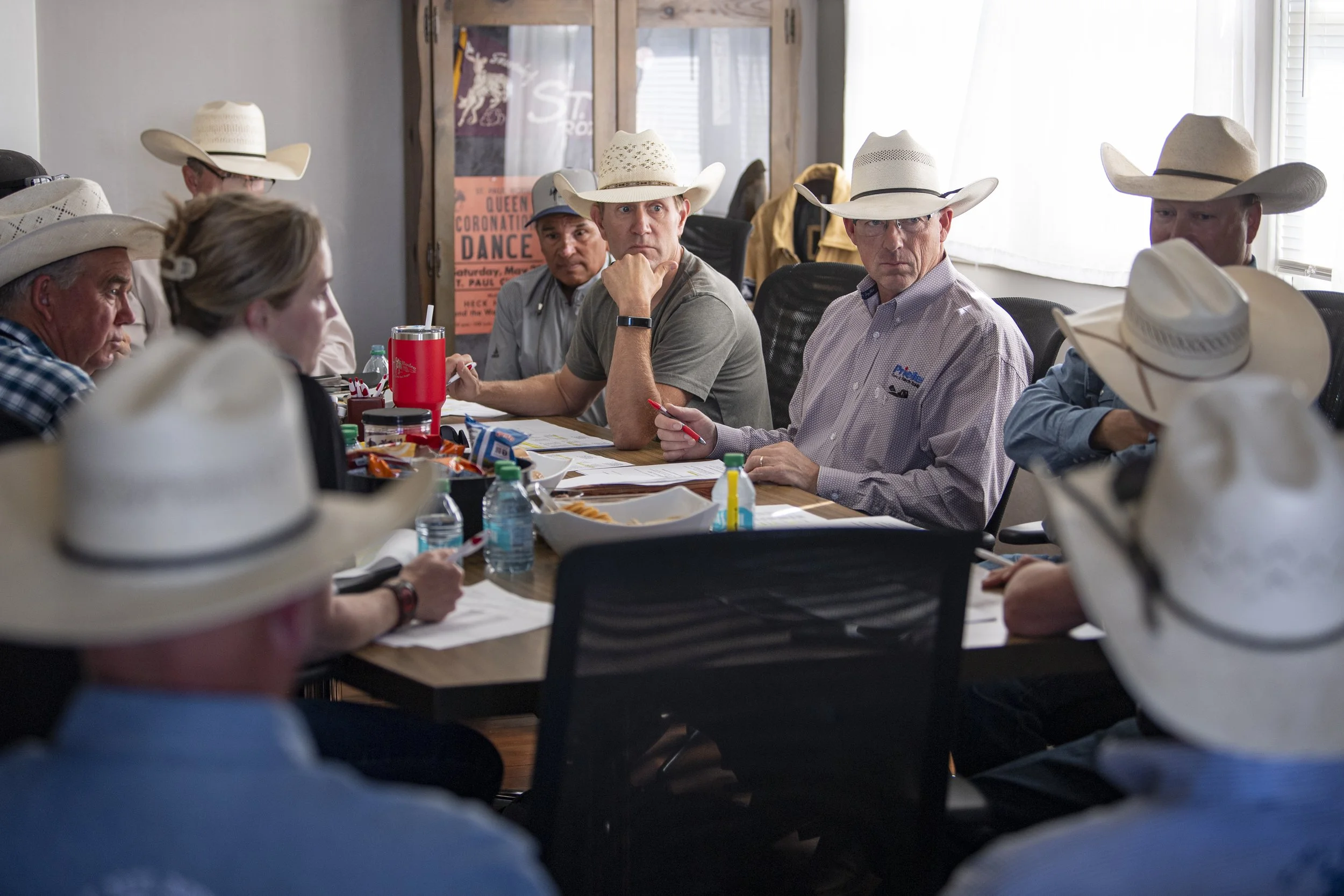 JJ Harrison, center, listens during a production meeting ahead of opening night at the 89th annual St. Paul Rodeo on Tuesday, July 1, 2025, in St. Paul, Ore.