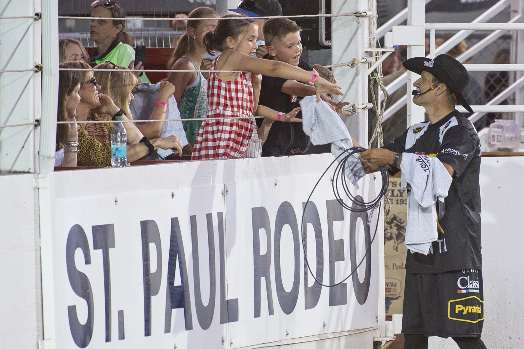 JJ Harrison entertains the crowd by tossing a football into the stands between events.
