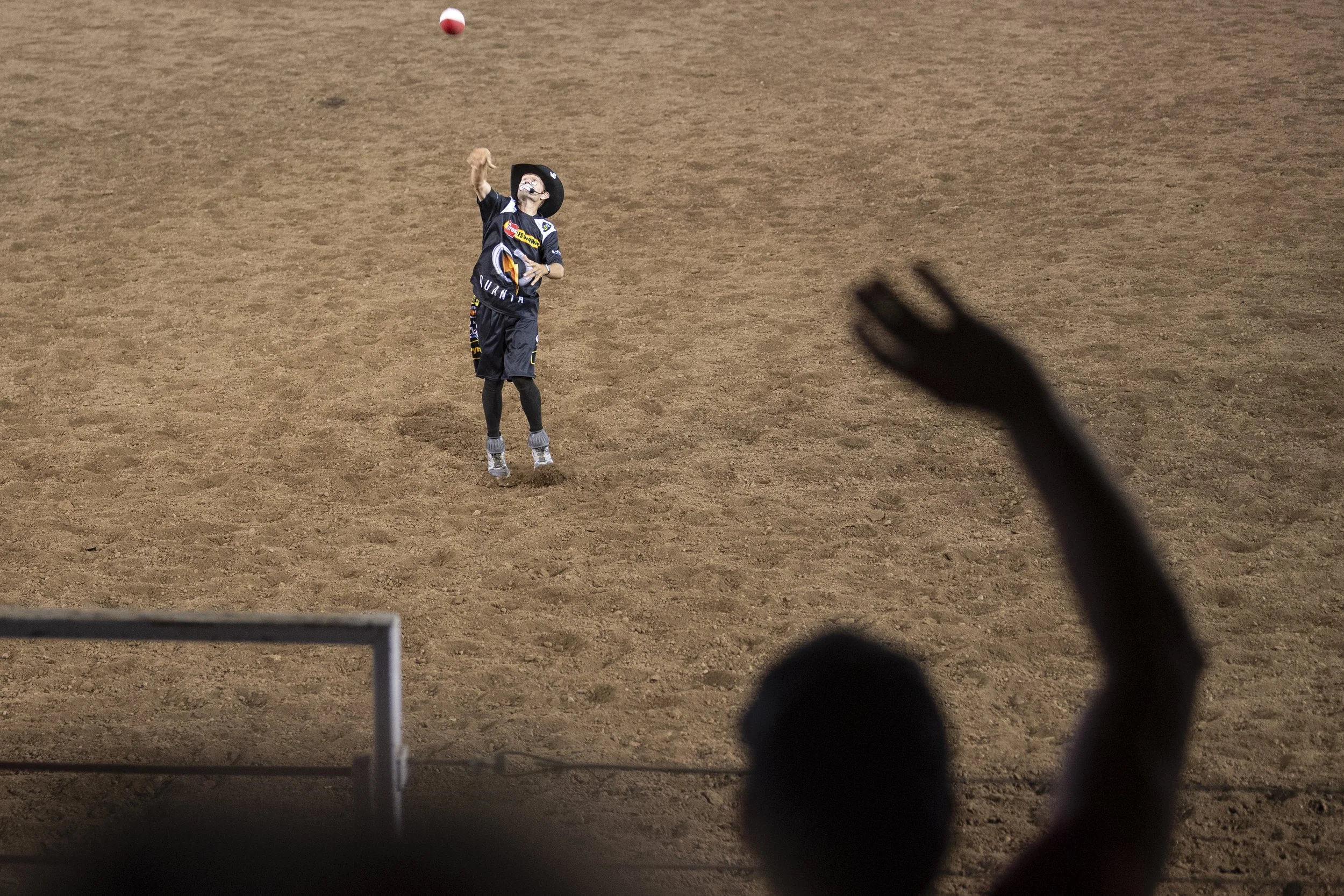 JJ Harrison entertains the crowd by tossing a football into the stands between events.
