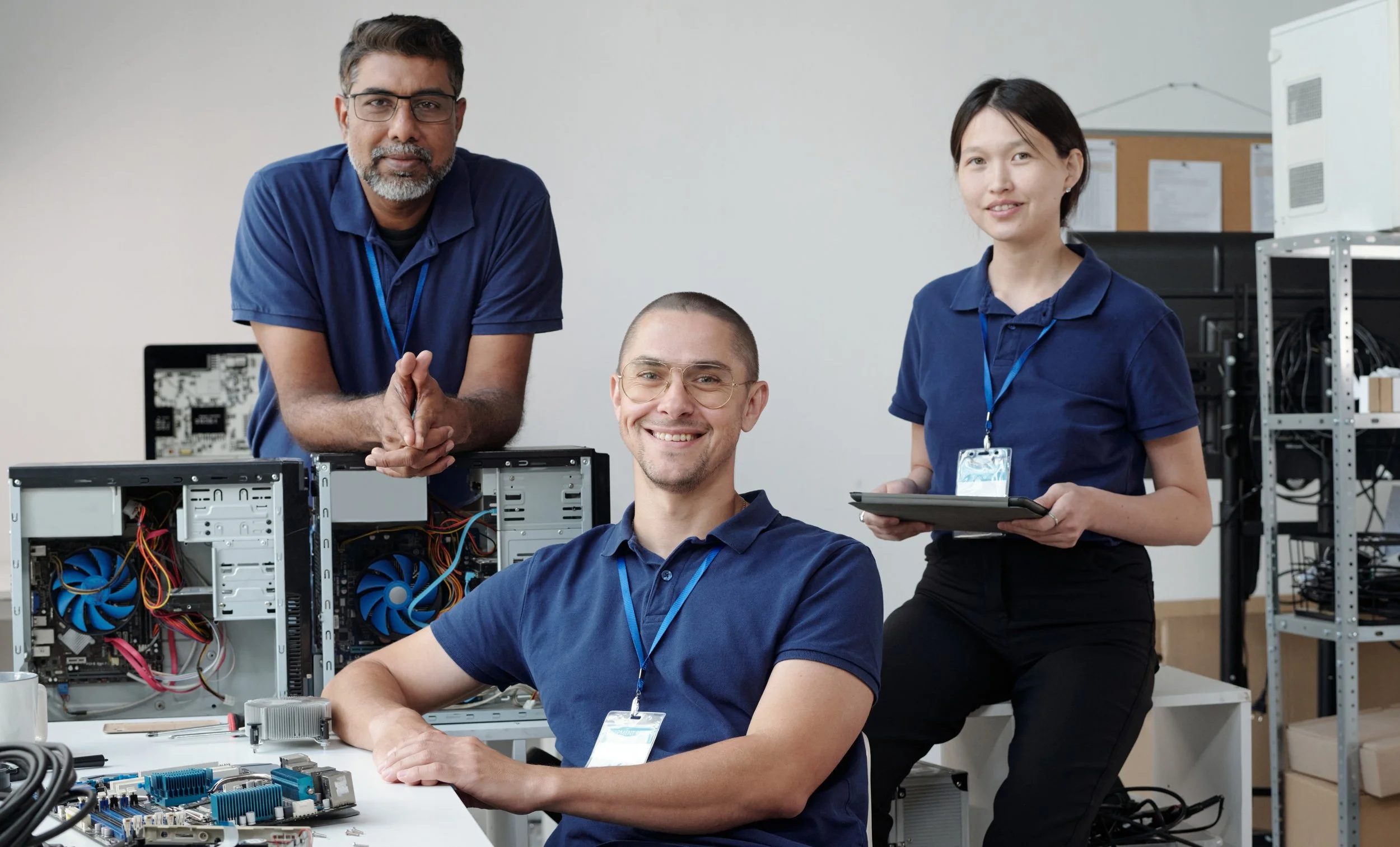 team of 3 technicians collaborating in office
