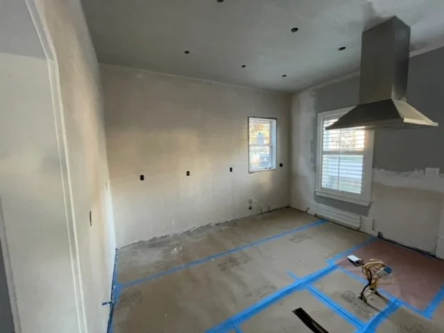 White Upper Cabinets With Dark Navy Lower Cabinets Kitchen Remodel by Malcolm Contracting Services LLC project photo 2